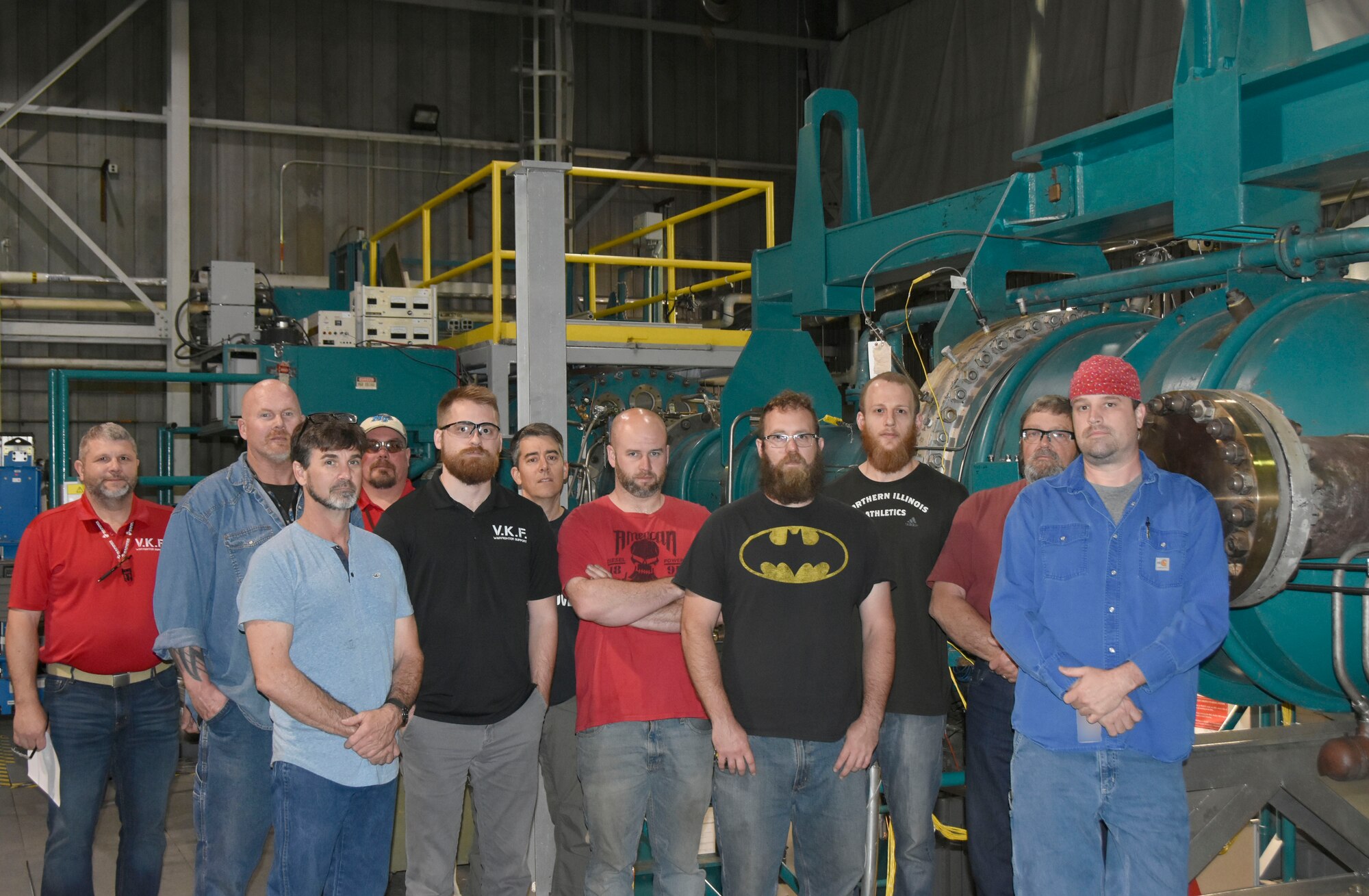 The von Kármán Gas Dynamics Facility Test crew poses for a group photo in front of the Mach 4 Aerotherm Nozzle assembly in Wind Tunnel C at Arnold Air Force Base. The group was recently recognized for repairing a leak discovered within the assembly during a water checkout. Pictured from left are Clarence “Remo” Rogers, Dan Randall, Adam Gilliland, Greg Crabtree, Brad Peckinpaugh, Tim Waggoner, Aaron Blaser, Josh Jernigan, David Faucett, Jim Crawford and Andy Houser. (U.S. Air Force photo by Bradley Hicks)