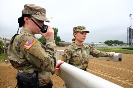 Soldiers with the 198th Military Police Battalion secure gates around Churchill Downs during races prior to the Kentucky Derby in Louisville, Ky., May 4, 2019.