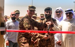 U.S. Army Col. Guy Reedy, 1st Theater Sustainment Command’s Operational Command Post chief of staff,  Kuwait Col. Abdullah Hamed Al-Masamah,  Khabari Crossing operations manager, and Jamal Al-Julawi, director general of customs administration cut the ribbon on a newly rennovated facility at Khabari Crossing, Kuwait, April 30, 2019.