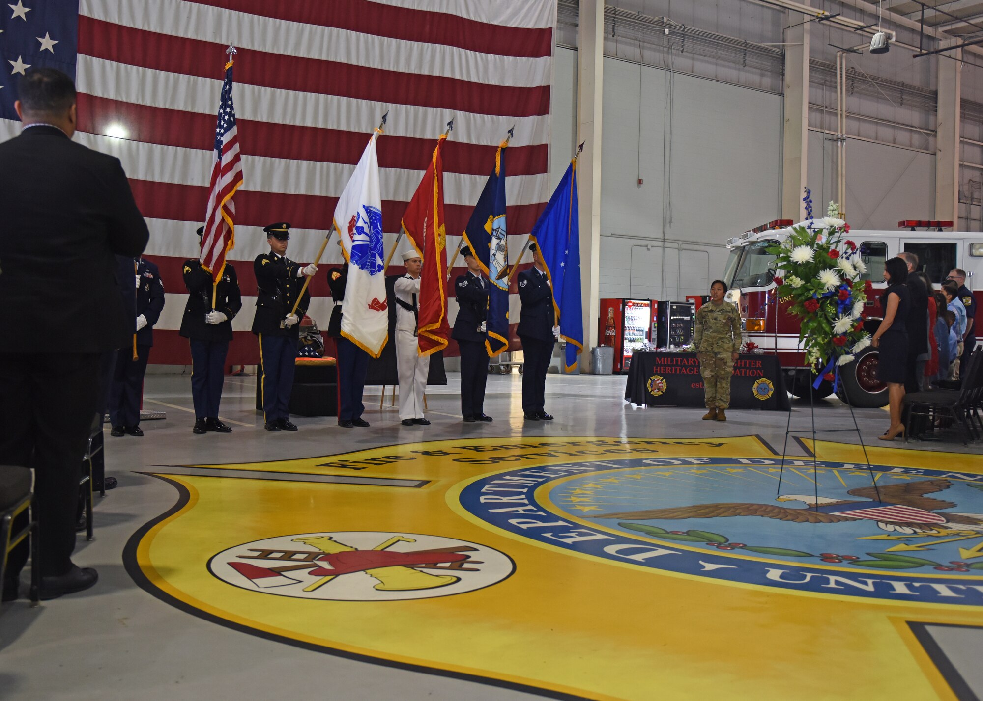 The Joint Service Color Guard post the colors, which began the Firefighter Memorial Ceremony in the Louis F. Garland Department of Defense Fire Academy High Bay at Goodfellow Air Force Base, Texas, May 3, 2019. This memorial was a way for Goodfellow to show its appreciation and honor those who have given the ultimate sacrifice. (U.S. Air Force photo by Airman 1st Class Zachary Chapman/Released)
