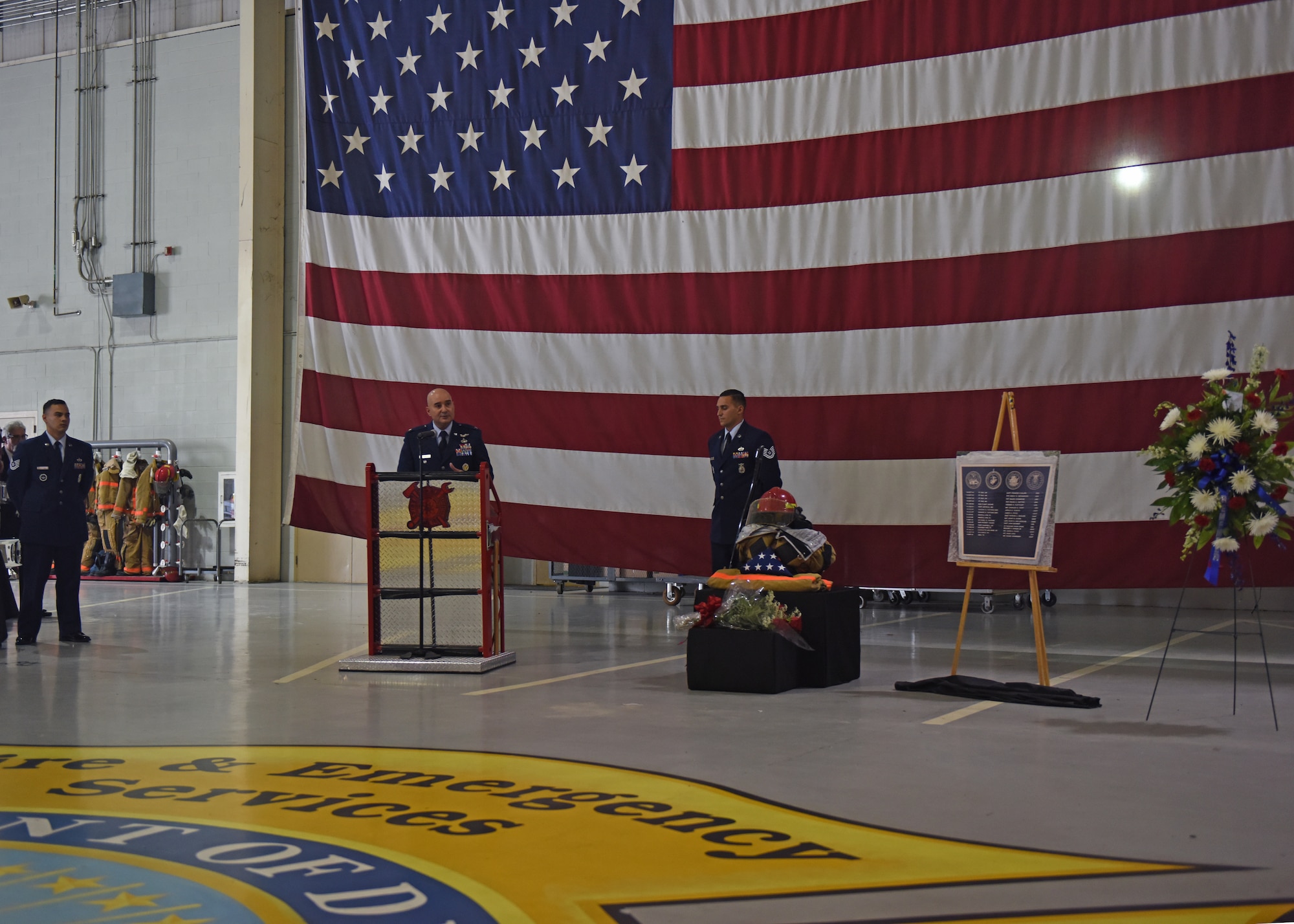 U.S. Air Force Col. Robert Ramirez, 17th Training Wing vice commander, speaks during the Firefighter Memorial Ceremony in the Louis F. Garland Department of Defense Fire Academy High Bay at Goodfellow Air Force Base, Texas, May 3, 2019. There are more than 100 names on the memorial, including the 10 names that were added during the ceremony. (U.S. Air Force photo by Airman 1st Class Zachary Chapman/Released)