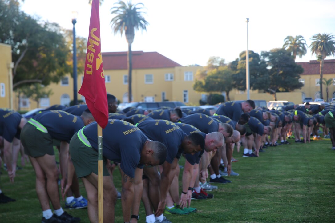 Stretching one...... following a motivational run, Marines cool down and stretch in order to keep their mind and body operating at peak physical performance.