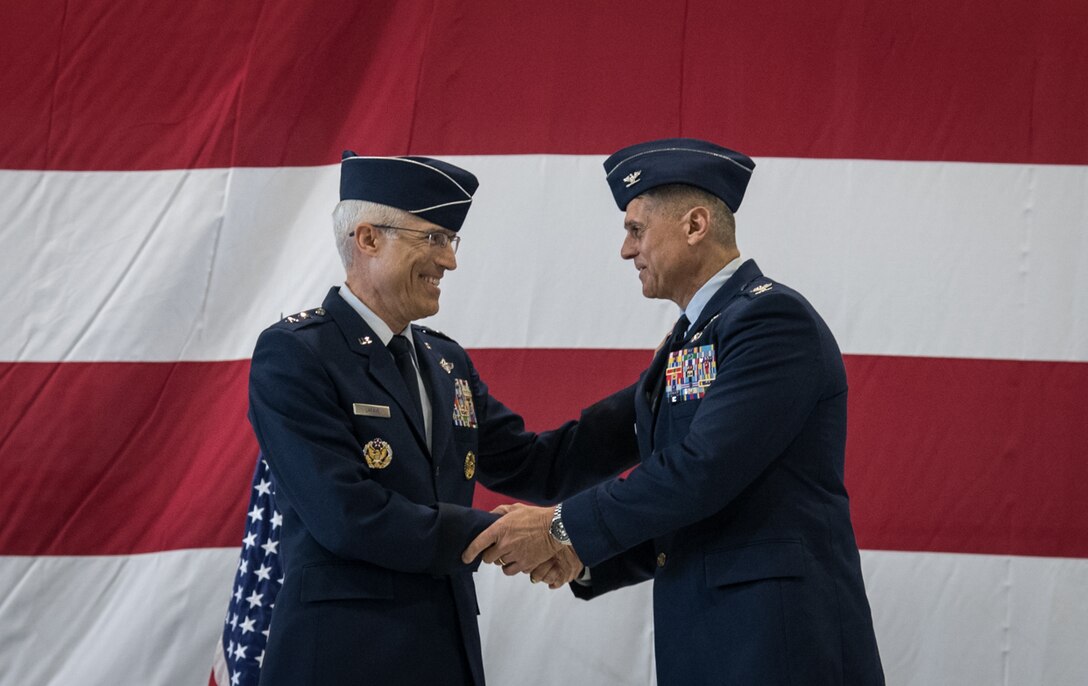 Maj. Gen. Craig La Fave, 22nd Air Force commander and Col. Glenn Collins, 932nd Airlift Wing commander shake hands during the assumption of command May 5, 2019, at Scott Air Force Base, Illinois. La Fave thanked Collins for responding to the call of duty and assuming command. (U.S. Air Force photo by Senior Airman Melissa Estevez)