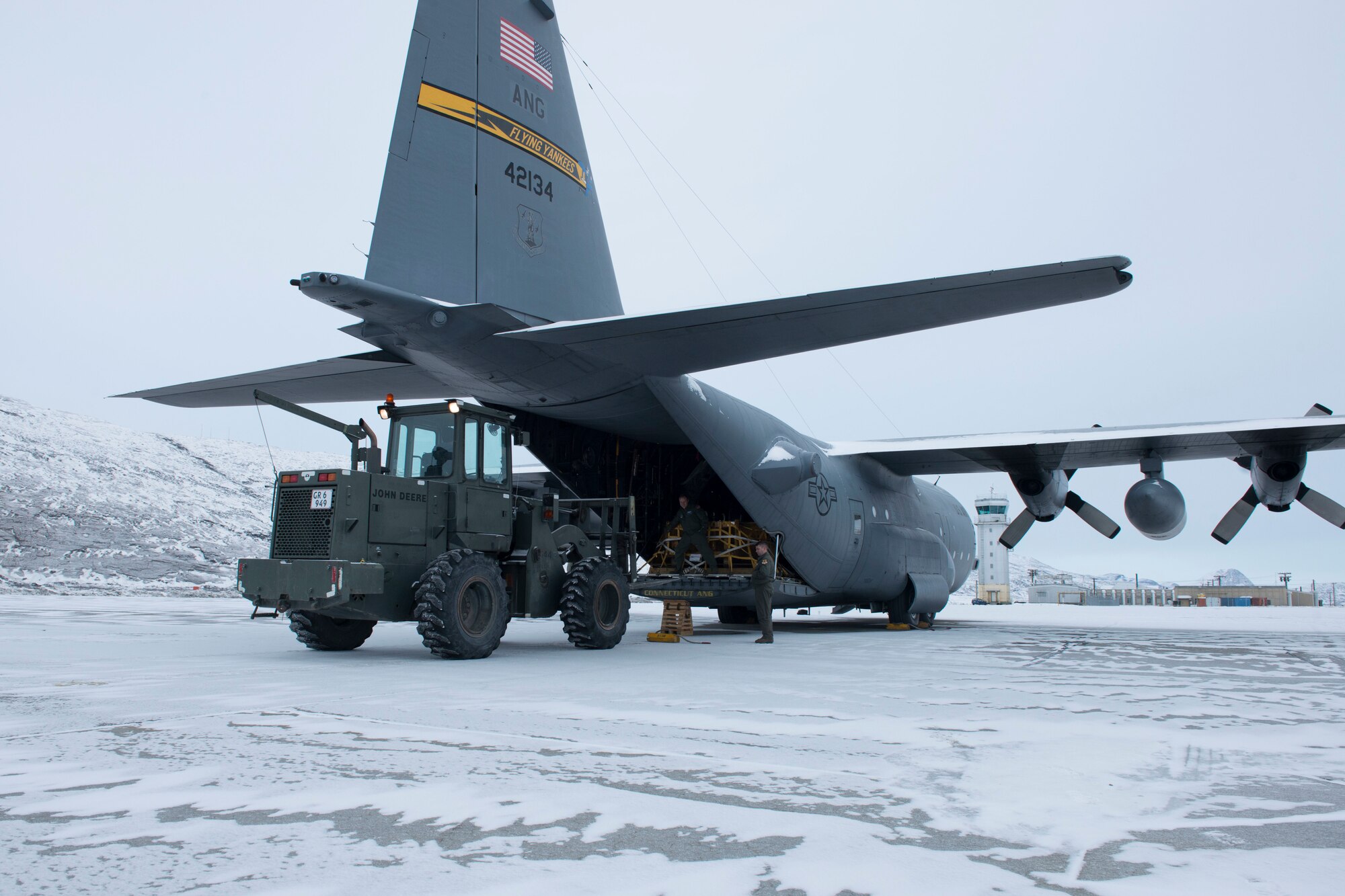 Members of the 103rd Airlift Wing, Connecticut Air National Guard load supplies onto a C-130 H aircraft, April 2, 2019 in Kangerlussuaq, Greenland. The 118th Airlift Squadron flew to Greenland in support of the National Science Foundation climate research mission. (U.S. Air National Guard photo by Tech. Sgt. Tamara R. Dabney)