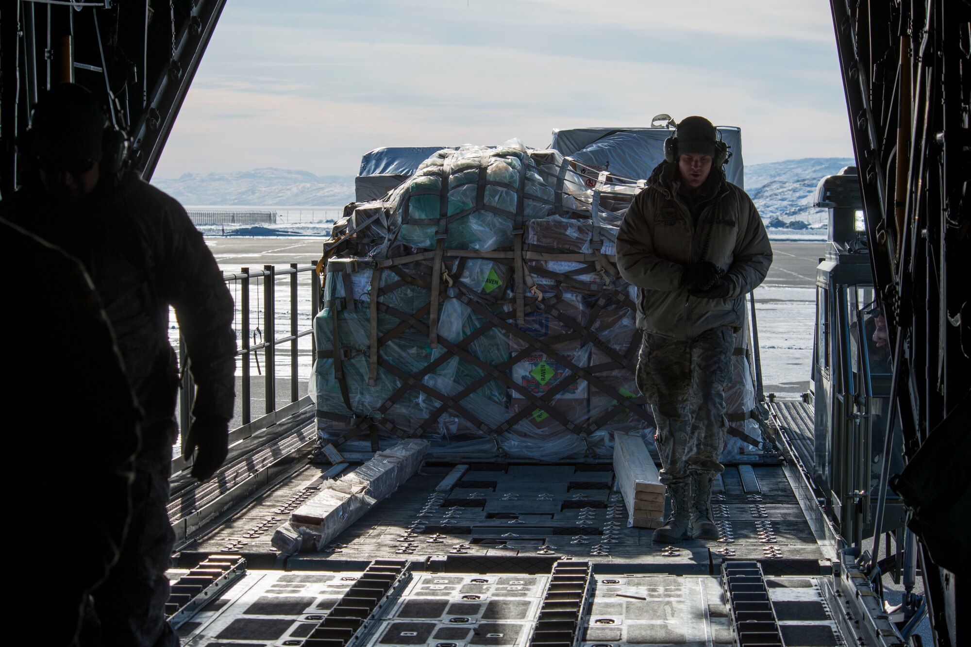 Airmen assigned to the 103rd Maintenance Squadron, Connecticut Air National Guard , load a pallet onto a C-130 H aircraft, April 1, 2019. The 118th Airlift Squadron flew to Greenland in support of a National Science Foundation climate research mission. (U.S. Air National Guard photo by Tech. Sgt. Tamara R. Dabney)