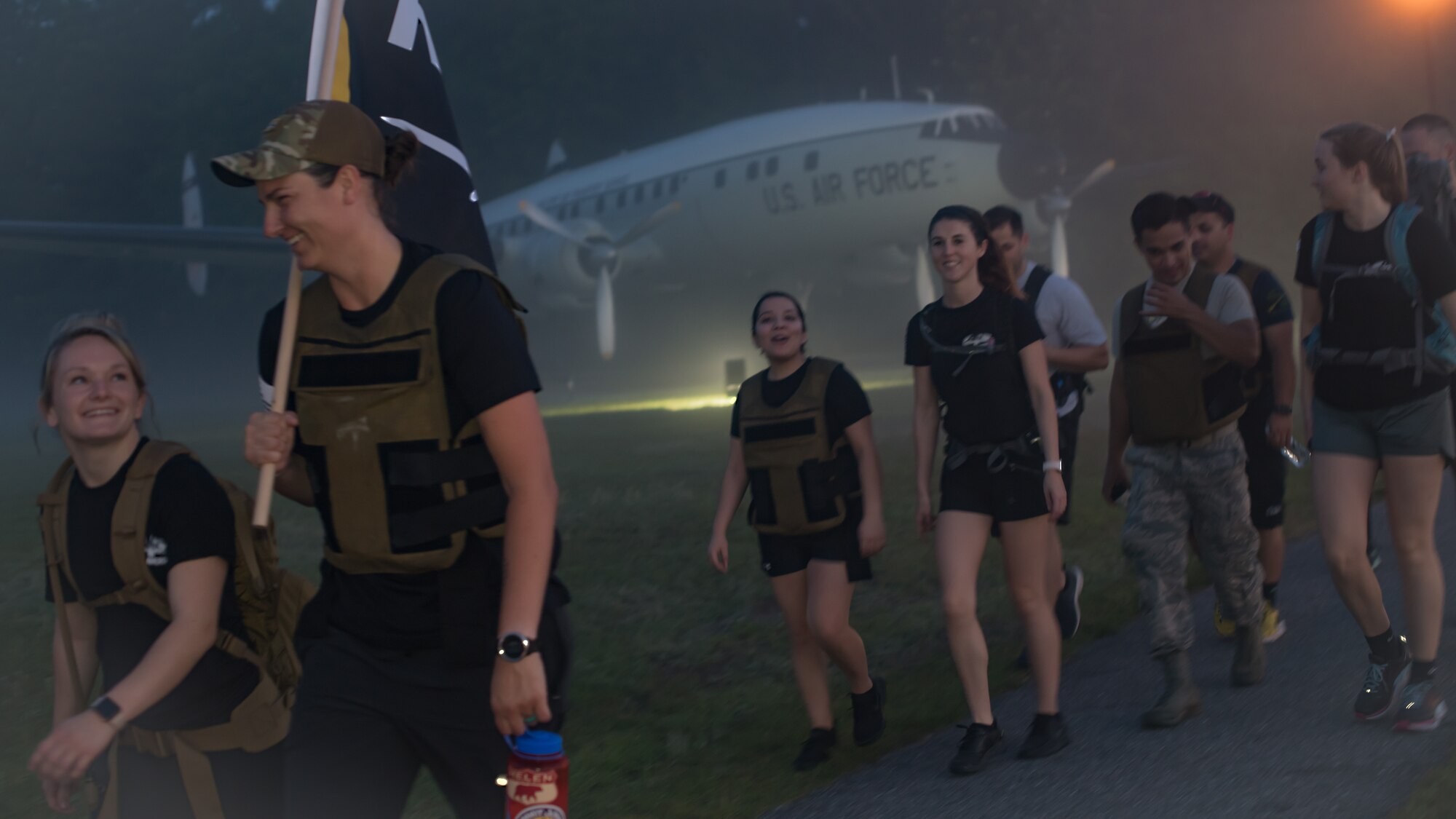 Airmen ruck march along a running trail May 1, 2019, at Joint Base Charleston, S.C. The Airmen participated in a nine-mile ruck march to remember the nine lives lost on May 2, 2018, in a C-130 aircraft crash in Port Wentworth, GA, in which JB Charleston, along with other agencies, provided response and recovery efforts.