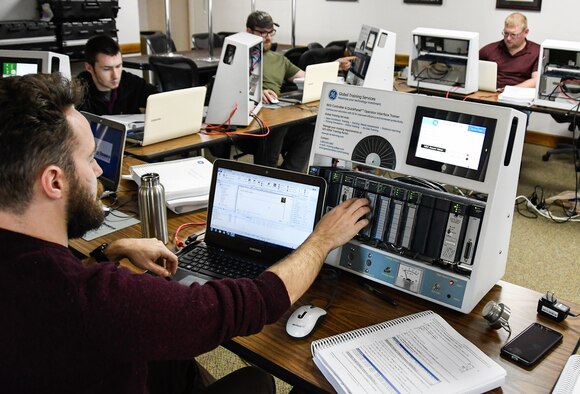 Alfred Gregg, an instrumentation, data and controls engineer at arc heaters on Arnold Air Force Base, and other engineers work on a troubleshooting exercise during a class April 18 at University of Tennessee Space Institute on programming and troubleshooting General Electric programmable logic controllers. Test Operations and Sustainment contractor, National Aerospace Solutions provided the week-long technical training course aimed at new instrumentation, data and controls engineers. PLCs are used for process control automation in many industries, said Curtis Walters, a NAS-nLogic supervisor in the Control Solutions Section. (U.S. Air Force photo by Jill Pickett)