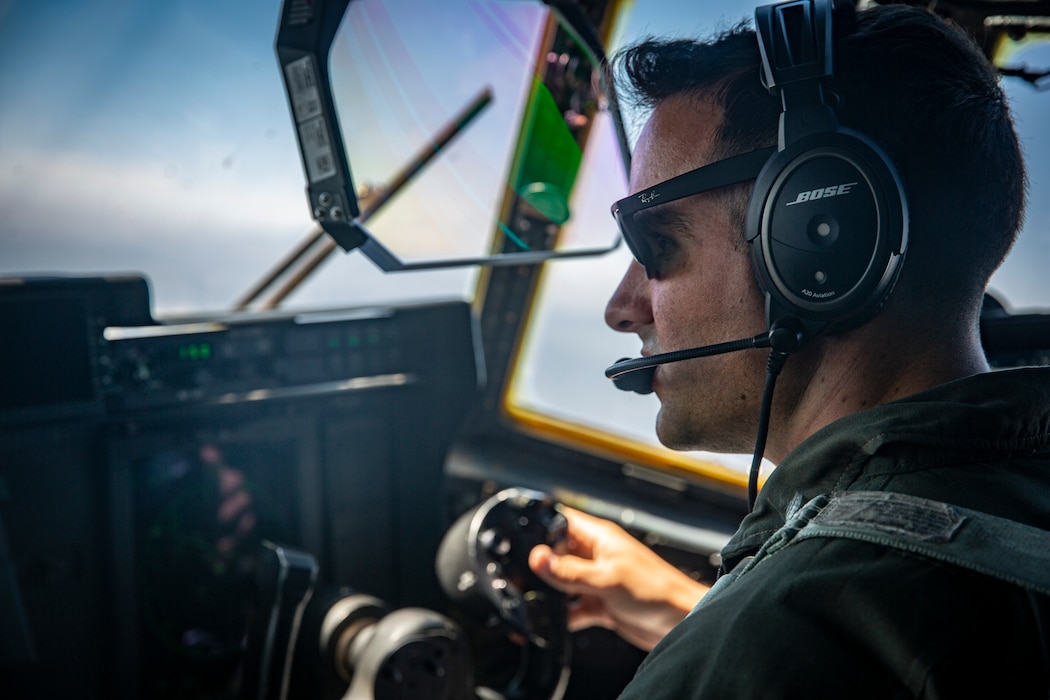 5/11 and VMGR-352 Marines load HIMARS onto KC-130J