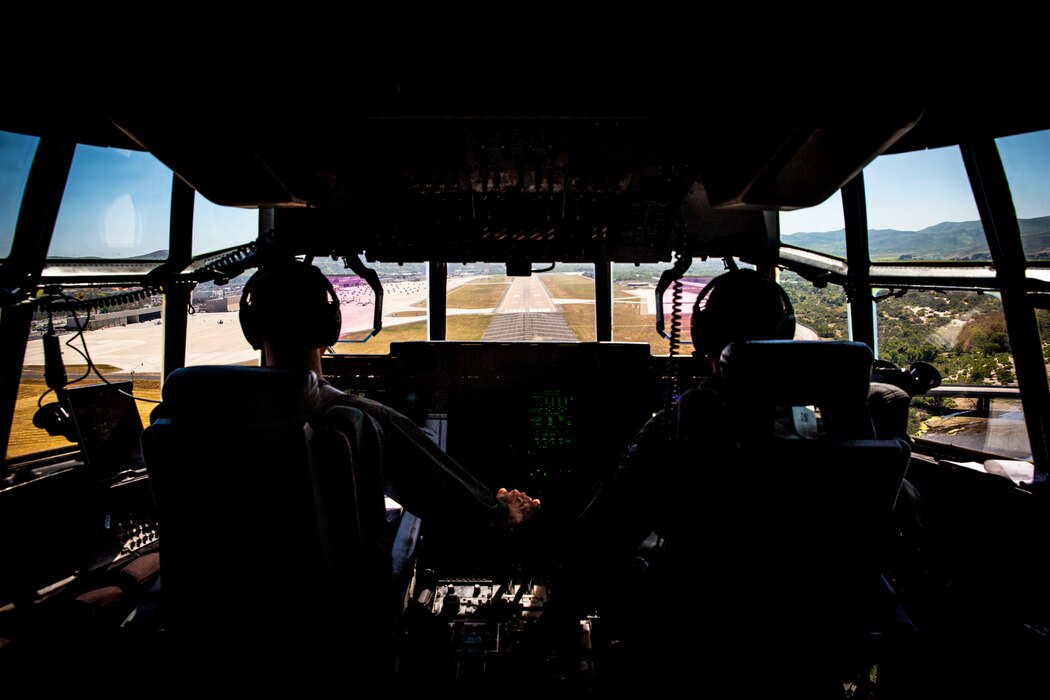 5/11 and VMGR-352 Marines load HIMARS onto KC-130J