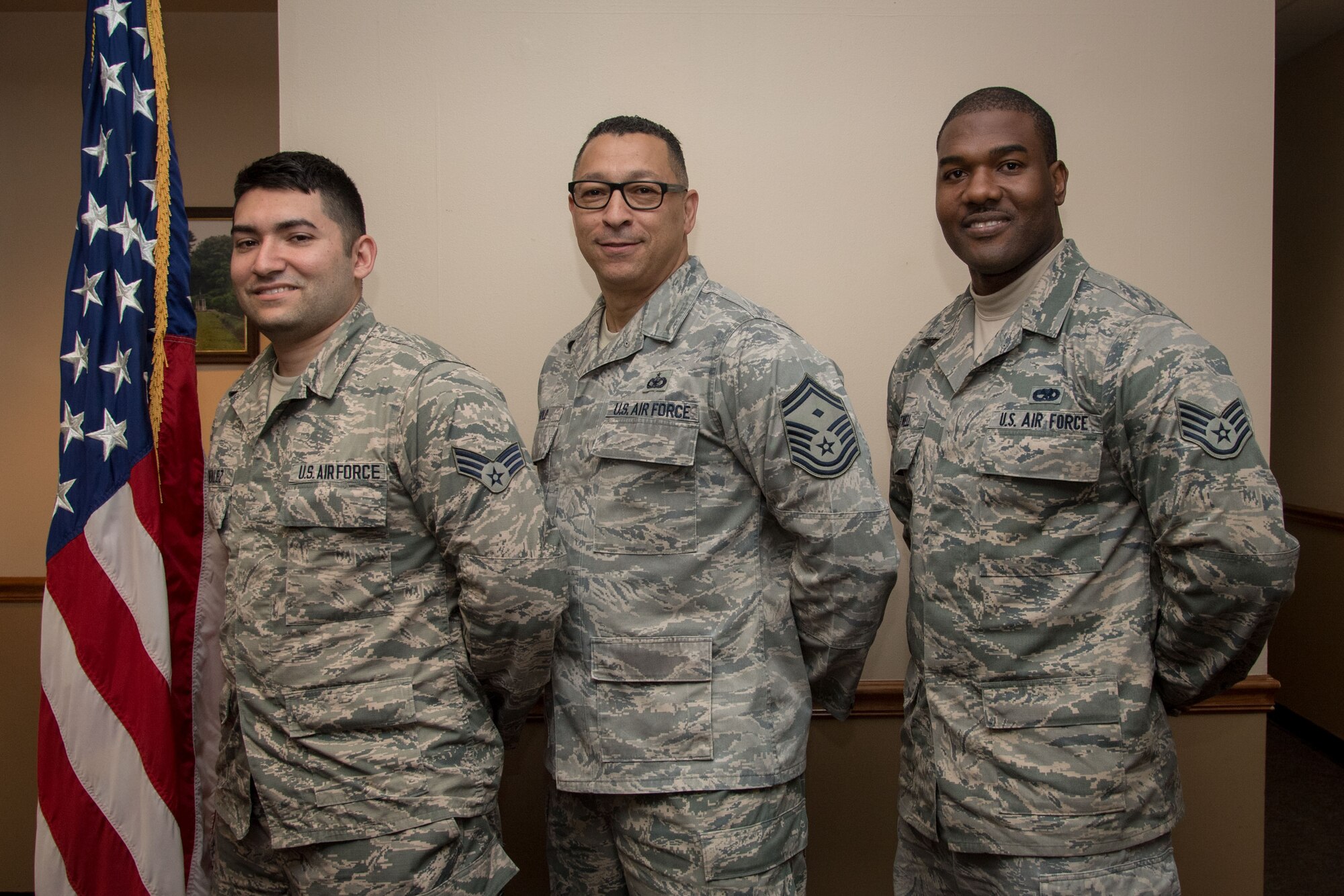 Senior Airman Saul Gonzalez, 514th Aeromedical Staging Squadron medic, Senior Master Sgt. David Gold, 88th Aerial Port Squadron first sergeant, and Staff Sgt. Ainsley J. Atwell, 714th Aircraft Maintenance Squadron aerospace propulsion and jet mechanic, all with the 514th Air Mobility Wing, Joint Base McGuire-Dix-Lakehurst, N.J., pose for a photo May 5, 2019, here. The three Reserve Citizen Airmen split their time between working as Airmen in three different squadrons at the Freedom Wing and firefighters at Engine Company 238 of the New York City Fire Department. Gold, a lieutenant in the FDNY, supervises Atwell and Gonzalez while at work in the firehouse.