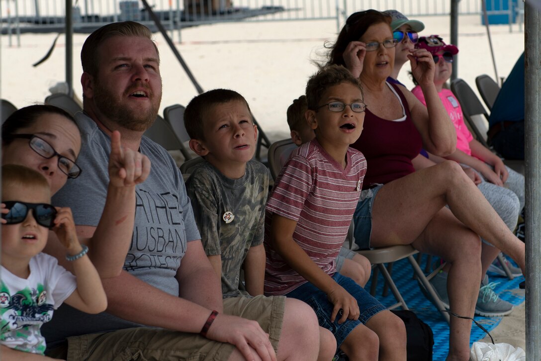 Make-A-Wish families watch the Thunderbirds fly in a practice session for the Keesler and Biloxi Air Show in Biloxi, Mississippi, May 3, 2019. After the practice session, the families were able to meet and get photos with the Thunderbird team. (U.S. Air Force photo by Airman 1st Class Kimberly L. Mueller)