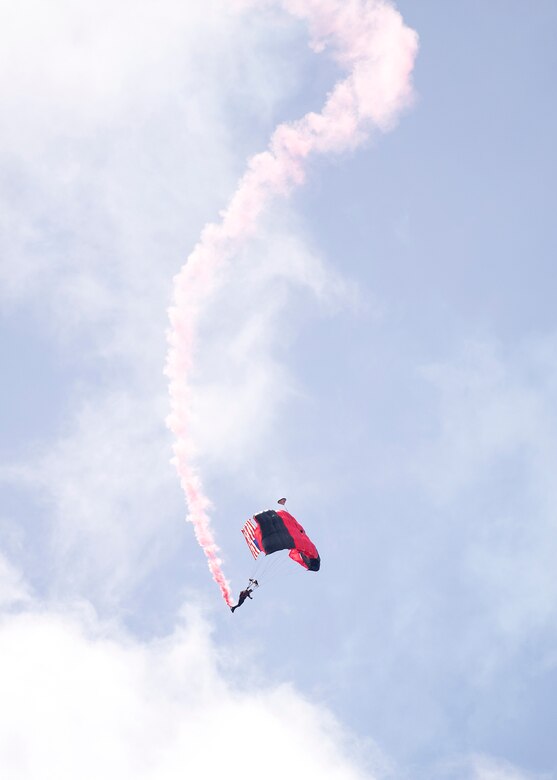 The Black Daggers, U.S. Army Special Operations Command Parachute Demonstration Team, parachute down carrying the U.S. Flag during the Keesler and Biloxi Air Show in Biloxi, Mississippi, May 5, 2019. The U.S. Air Force Thunderbirds are headlining the Keesler and Biloxi Air Show May 4-5. Thunder Over the Sound is a unique, one-of-a-kind event where a base and its surrounding city jointly host an air show geographically separated. (U.S. Air Force photo by Airman 1st Class Kimberly L. Mueller)