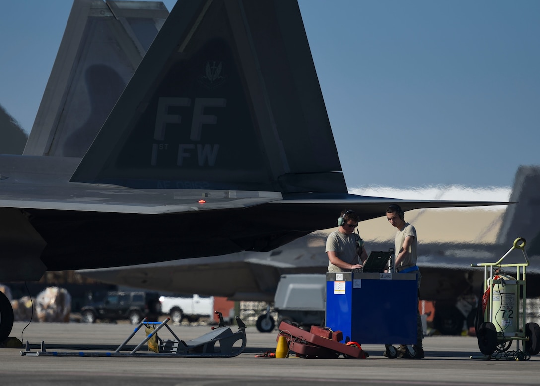 Two Airmen conduct pre-flight checks during Checkered Flag 19-1 at Tyndall Air Force Base, Florida, May 6, 2019.