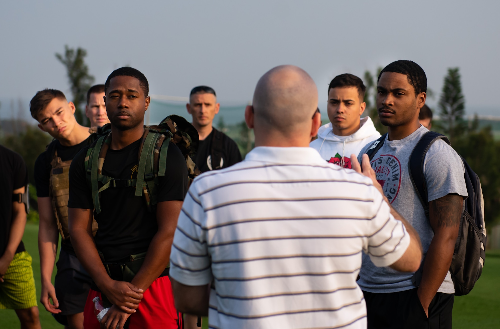 William McEvoy, Chief Historian assigned to the 18th Wing, center, speaks to service members and veterans during the Holocaust Remembrance Week Ruck March at Kadena Air Base, Japan, May 2, 2019.