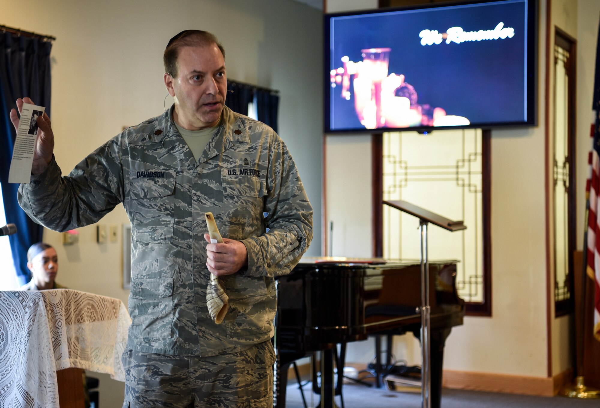 Rabbi (Maj.) Gary Davidson, U.S. Air Force chaplain, speaks during Kunsan Air Base’s Holocaust Remembrance Ceremony at the Base Chapel on May 2, 2019. Davidson served as the ceremony’s keynote speaker. He closed his speech by blowing a shofar, an ancient musical horn made of a ram’s horn, as a sign of inspiration, humanity, and strength in the Jewish religion. (U.S. Air Force photo by Capt. Remoshay Nelson)