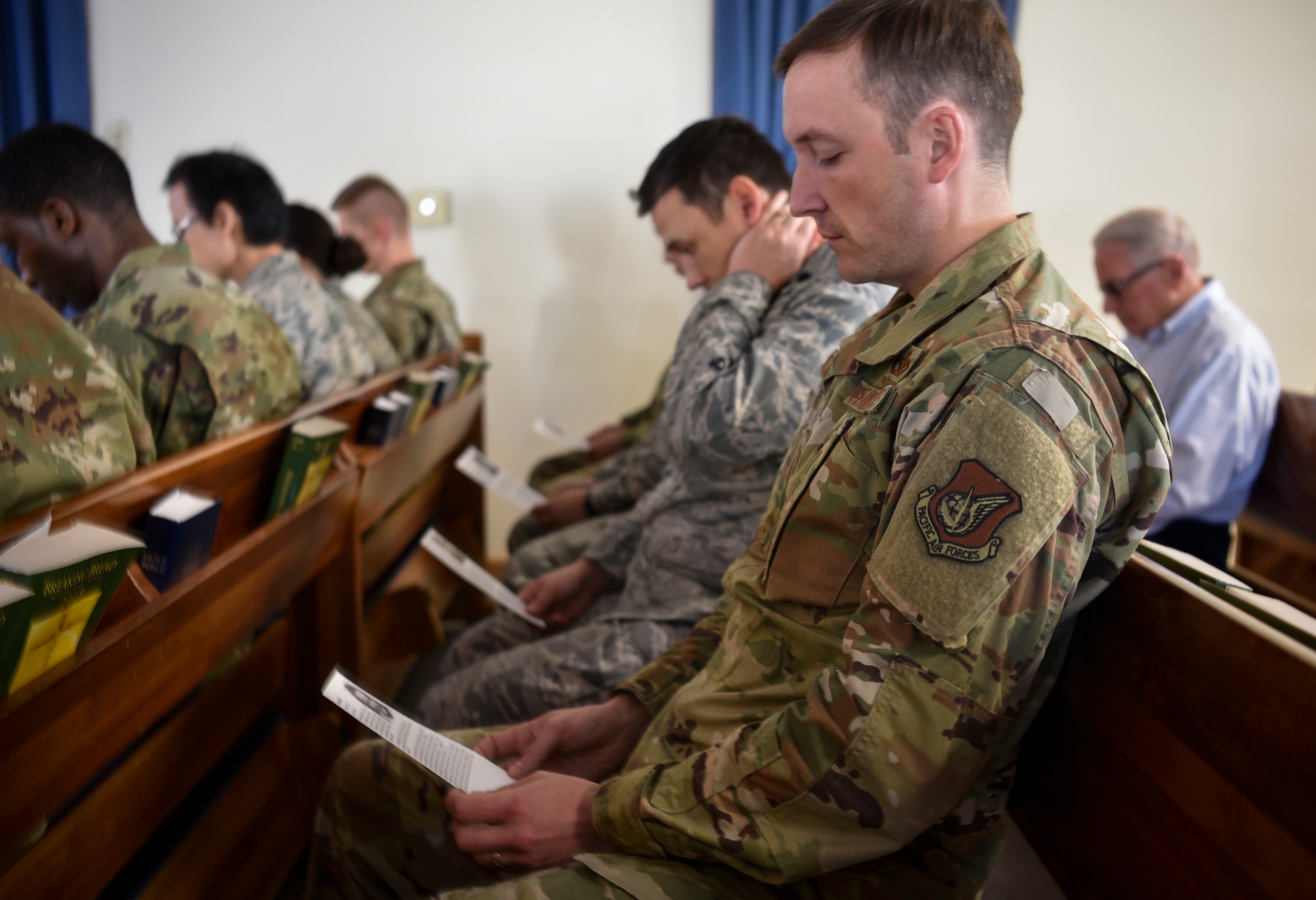Airmen read stories of different Holocaust victims and survivors during a remembrance ceremony on Kunsan Air Base, Republic of Korea, May 2, 2019. The theme of this year’s remembrance is “Learning from the Holocaust: Beyond Religious Boundaries,” and while many Holocaust victims were in fact Jewish, other innocent targets included Polish, Africans, Muslims, and people with disabilities. (U.S. Air Force photo by Capt. Remoshay Nelson)