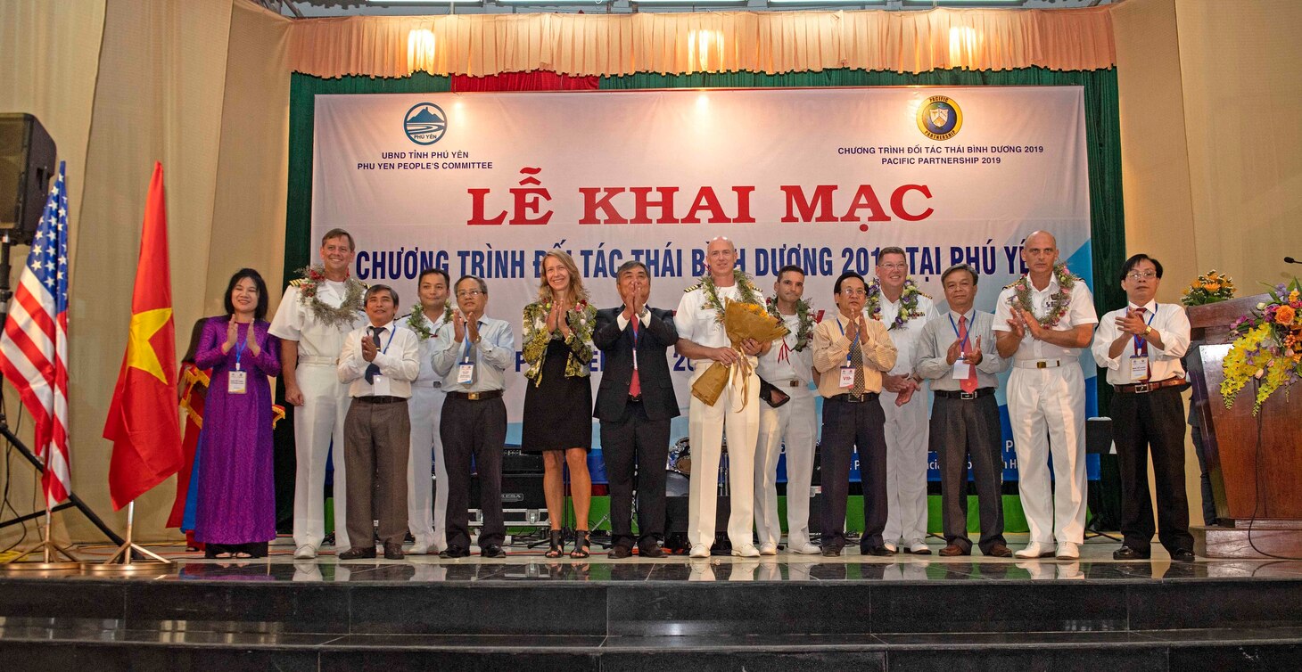 TUY HOA, Vietnam (May 6, 2019) Representatives from the local government of the Phu Yen Province pose for a group photo with Pacific Partnership 2019 leadership during the opening ceremony at the Hall of the Provincial Labor Union during Pacific Partnership 2019. Pacific Partnership, now in its 14th iteration, is the largest annual multinational humanitarian assistance and disaster relief preparedness mission conducted in the Indo-Pacific.