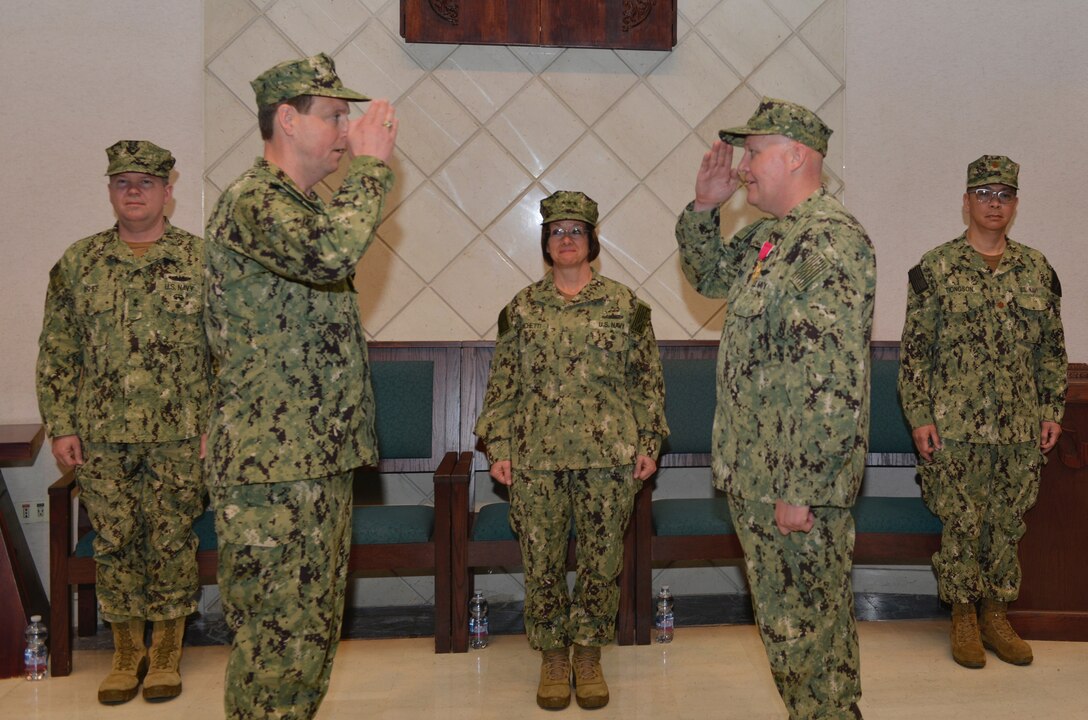 Capt. Roger E. Meyer, commander, Task Force 69, is relieved by Capt. James E. O’Harrah during a change of command ceremony at Naval Support Activity Naples, May 6, 2019.