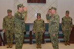 Capt. Roger E. Meyer, commander, Task Force 69, is relieved by Capt. James E. O’Harrah during a change of command ceremony at Naval Support Activity Naples, May 6, 2019.