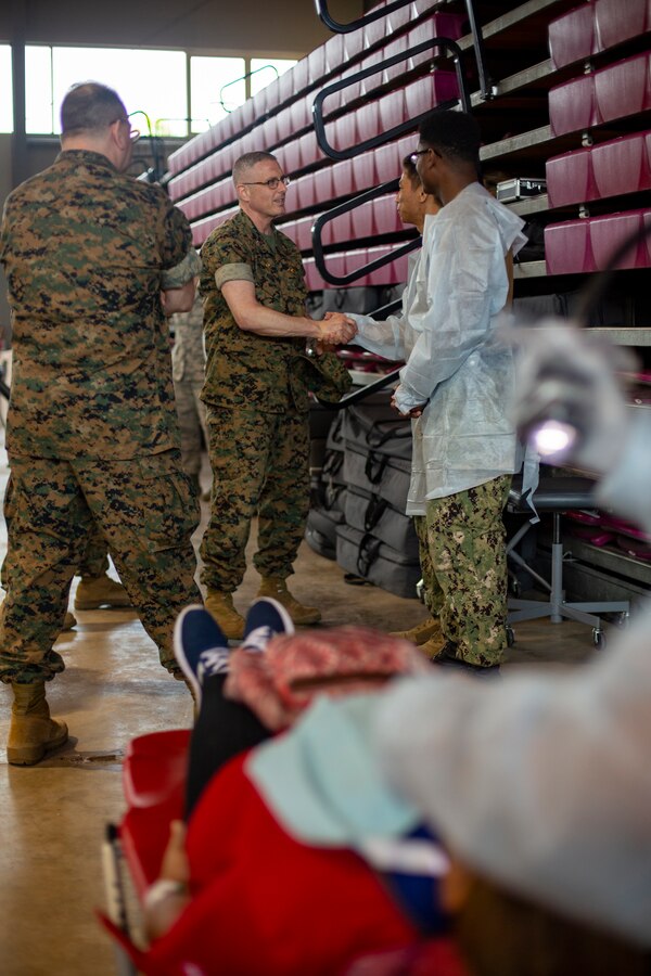 U.S. Navy Capt. Gregory Klein, the commanding officer of 4th Dental Battalion, 4th Marine Logistics Group, Marine Forces Reserve, shakes hands with Sailors at Ponce, Puerto Rico, May 2, 2019, during Innovative Readiness Training Puerto Rico. IRT Puerto Rico is also called Ola de Esperanza Sanadora, which translates to Healing Wave of Hope. MARFORRES Sailors are working jointly with several National Guard and Reserve units from across the nation to provide medical care in Puerto Rico during a two-week medical exercise. (U.S. Marine Corps photo by Sgt. Andy O. Martinez)