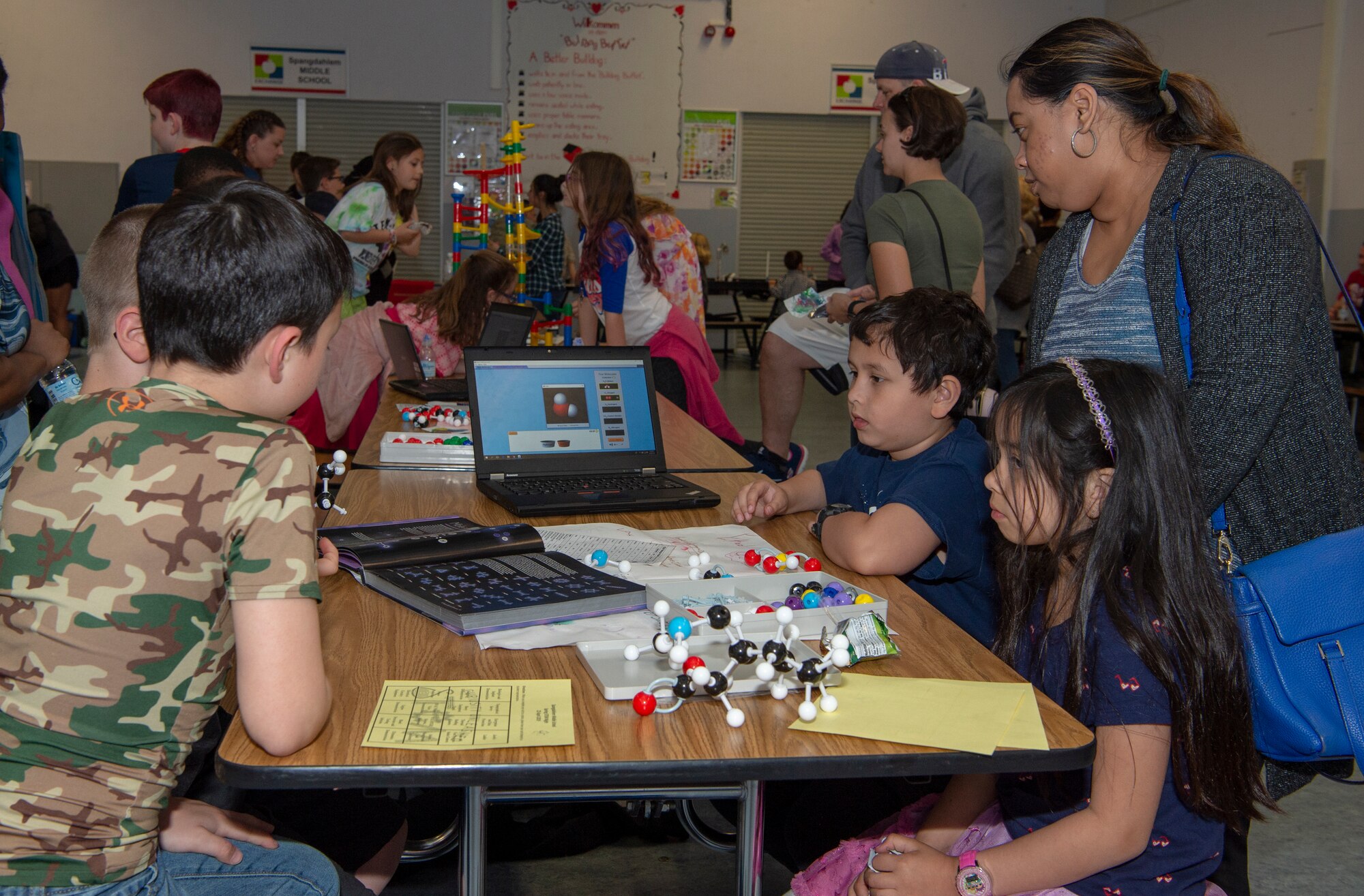 The students used interactive simulations to build molecules.