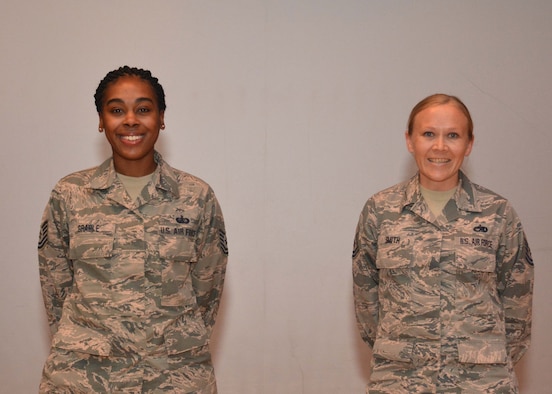 Tech. Sgt. Jocilyn Grable, 507th Air Refueling Wing Development and Training Flight program manager, and Master Sgt. Jessica Smith, 507th Operations Group career assistance advisor, are recognized for recently attaining Community College of the Air Force degrees during the May UTA commander's call at the base theater, May 5, 2019, Tinker Air Force Base, Oklahoma. (U.S. Air Force photo by Senior Airman Mary Begy)