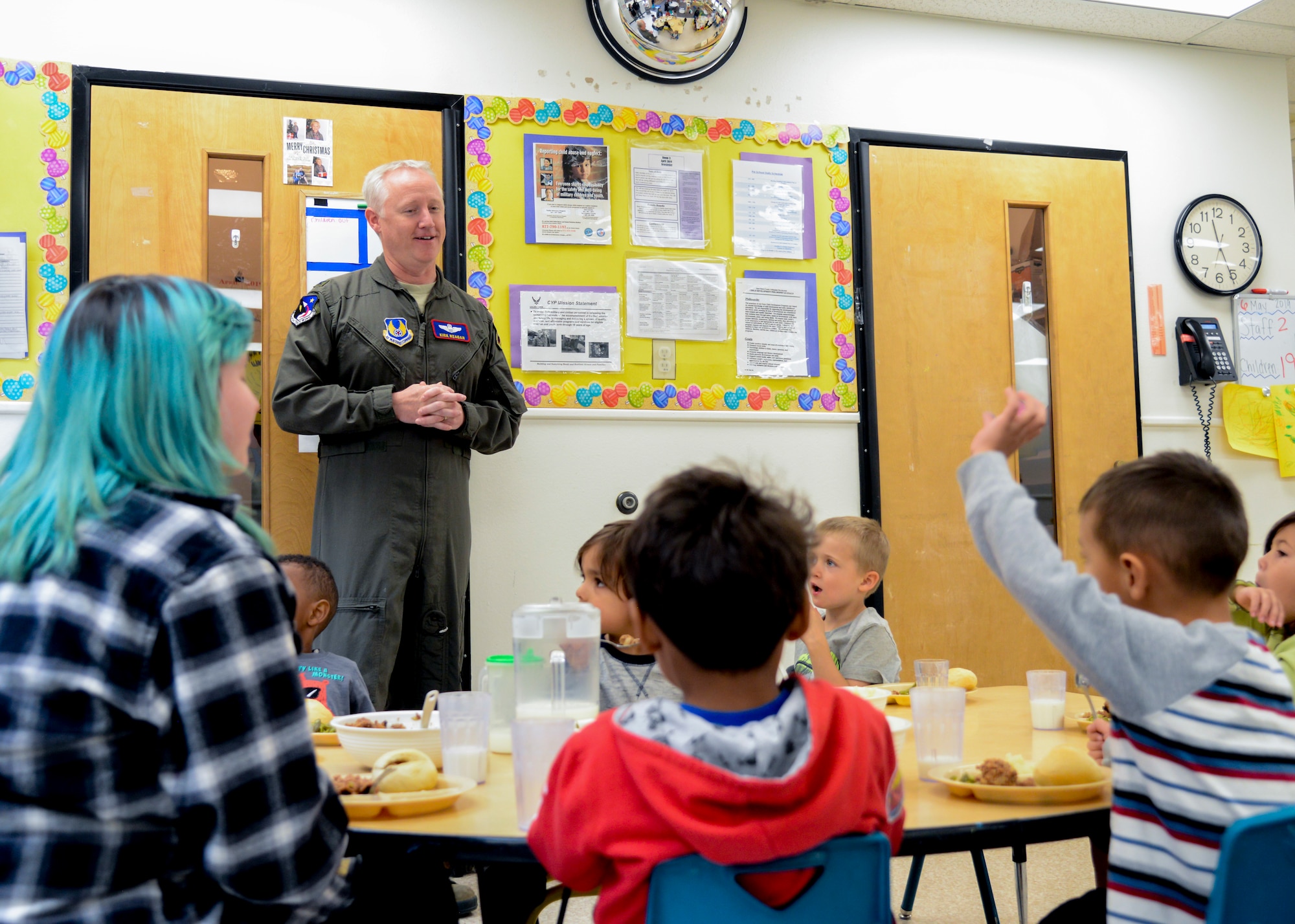 Col. Kirk Reagan, 412th Test Wing vice commander, talks to children and child care providers during a tour of the Child Development Center on Edwards Air Force Base, Calif., May 6. The visit helped kick off Provider Appreciation Week which lets parents, children and base leadership show their appreciation and say thank you to the Edwards child care providers. (U.S. Air Force photo by Giancarlo Casem)