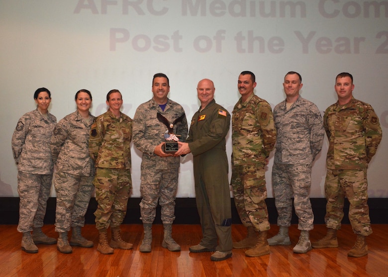 The 507th Air Refueling Wing Commander, Col. Miles Heaslip, stands for a photograph with members of the 507th ARW Command Post for receiving the Medium Command Post of the Year award May 5, 2019, Tinker Air Force Base, Oklahoma. (U.S. Air Force photo by Senior Airman Mary Begy)