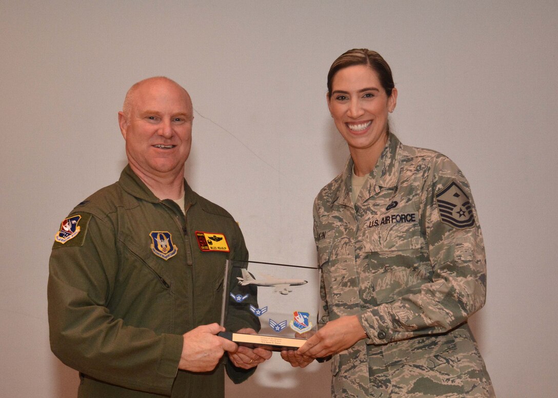 Master Sgt. Jennifer Pipkin, 507th Security Forces Squadron first sergeant, accepts the Airman of the Quarter award for the first quarter on behalf of Senior Airman Susan Daves, 507th SFS, during the May UTA commander's call at the base theater, May 5, 2019, Tinker Air Force Base, Oklahoma. (U.S. Air Force photo by Senior Airman Mary Begy)