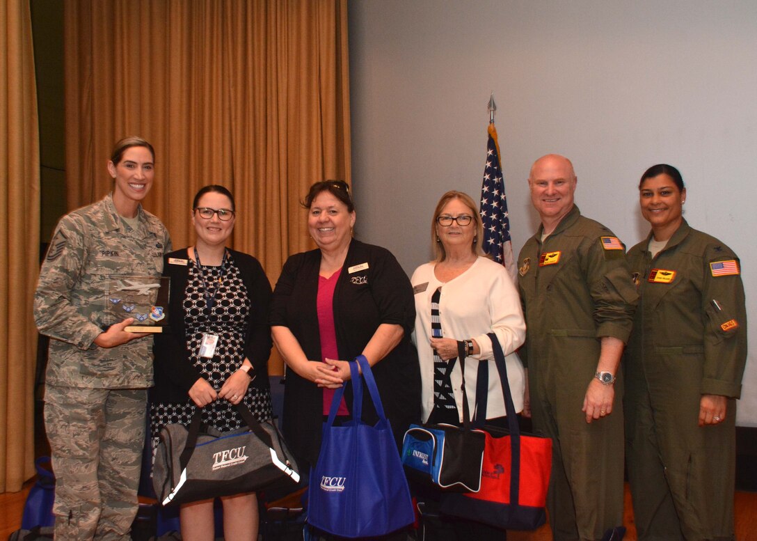 Master Sgt. Jennifer Pipkin, 507th Security Forces Squadron first sergeant, stands with the 507th Air Refueling Wing's leadership and community partners after accepting the Airman of the Quarter award for the first quarter on behalf of Senior Airman Susan Daves, 507th SFS, during the May UTA commander's call May 5, 2019, Tinker Air Force Base, Oklahoma. (U.S. Air Force photo by Senior Airman Mary Begy)