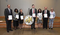 The Association of the U.S. Army Redstone-Huntsville Chapter recognizes 26 government civilians from 10 organizations across Team Redstone April 30 during its 2019 Department of the Army Civilian of the Year Awards Dinner. DA Civilians of the Year include, from left, Thomas Webber, Management Executive, director, U.S. Army Space and Missile Defense Command/Army Forces Strategic Command Technical Center; Sophia Colquiett, Technical/Technical Management; Sofia Bledsoe, Professional/Technical; Warren Keith, Professional/Technical; Carol Hermann, Supporting Staff, USASMDC/ARSTRAT Tech Center executive assistant; Charles Garner, Department of Defense; and Melissa Richards, Non-Appropriated Funds. Also nominated from SMDC this year were Erica Ignont and Harriet Clark. (U.S. Army photo by Bryan Bacon)