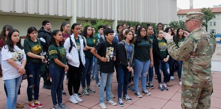 Col. Dan Bonnichsen, U.S. Army Medical Department Center and School, Health Readiness Center of Excellence chief of staff, welcomes students from the McCollum High School health science class during a visit to the learn about Army Medicine.