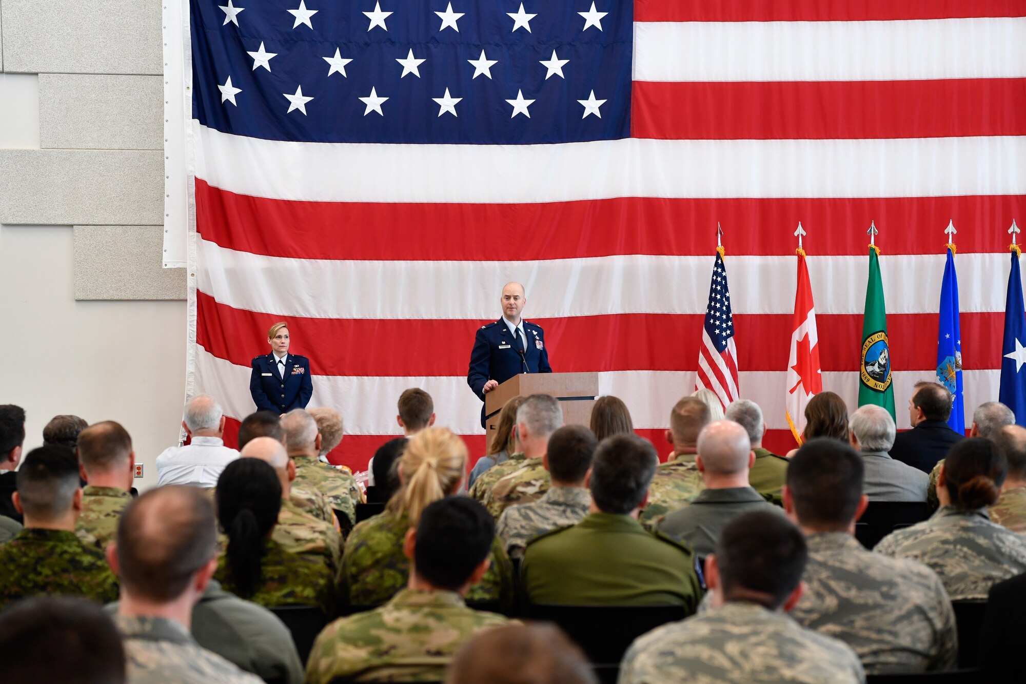 Col. Brett Bosselmann addresses the 225th Support Squadron after assuming command at the Pierce County Readiness Center, Camp Murray, Washington, April 10, 2019. (U.S. Air National Guard photo by Capt. Colette Muller)