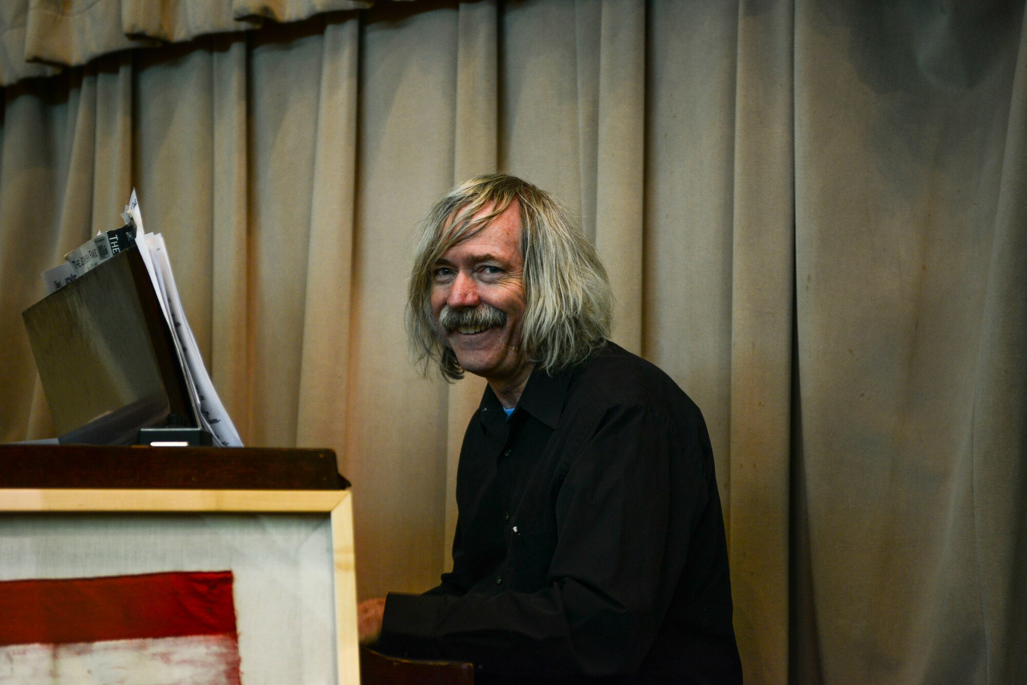 A local pianist plays music for those waiting to see the play “Corrie Remembers,” the true story of a woman who saved nearly 800 Jewish people during the Holocaust, at Kirtland Air Force Base, N.M., May 3, 2019. The Kirtland AFB Chaplain Corps hosts an annual Days of Remembrance event to honor the lives lost and those who survived.