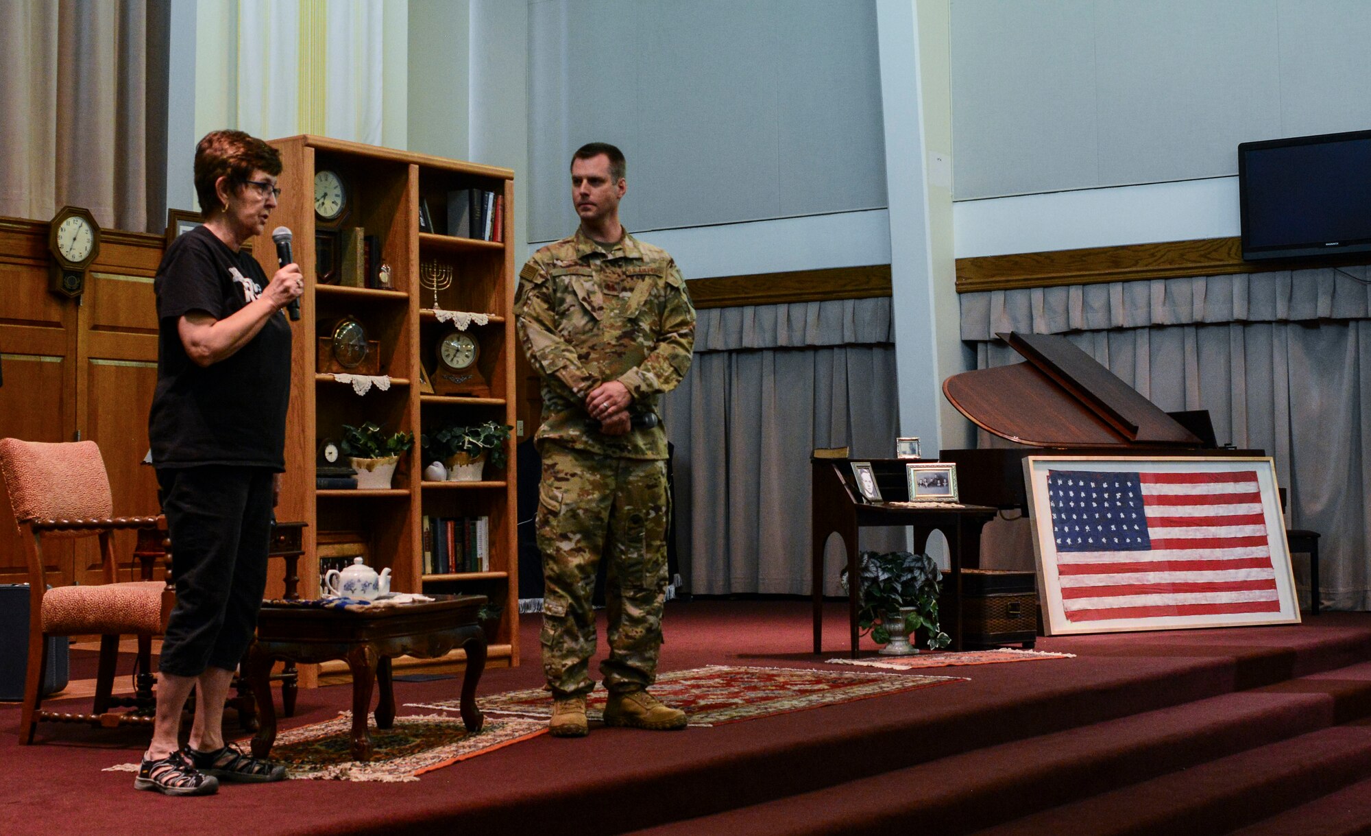 U.S. Air Force Capt. Andy Peck, 58th Special Operations Wing chaplain, and the director of “Corrie Remembers” give opening remarks before beginning the play at Kirtland Air Force Base, N.M., May 3, 2019. The play is based on the true life story of Corrie Ten Boom, who saved nearly 800 Jewish lives during the Holocaust.