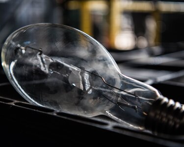One of the old light bulbs removed from a socket at Joint Base Langley-Eustis, Virginia, April 30, 2019. (U.S. Air Force photo by Airman 1st Class Marcus M. Bullock)