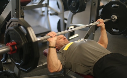 Lt. Gen. Bradley A. Becker, IMCOM Commanding General, lifts weights during filming of a video for STRONG B.A.N.D.S. April 5 at Joint Base San Antonio-Fort Sam Houston.