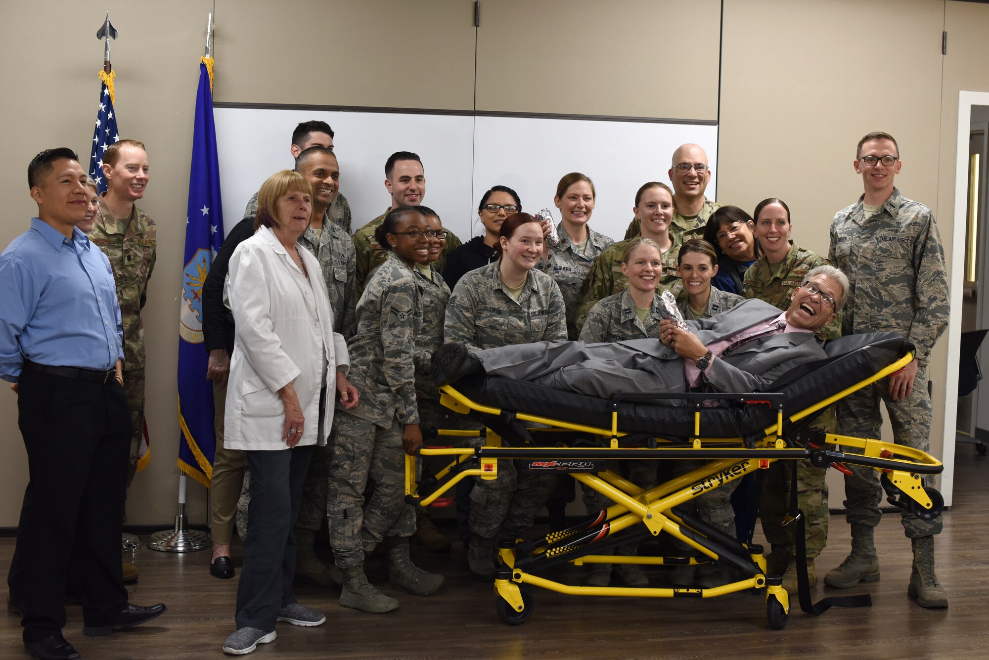 Airmen of the 377th Medical Group's Family Health Clinic pose for a photo with Steve Stucker, host of the Morning Shift Salute, at the 377th MDG April 30, 2019. The Family Health Clinic was recently awarded Air Force Global Strike Command's Outstanding Medical Home award, as well as the 377th Air Base Wing Team of the Year. (U.S. Air Force photo by Senior Airman Eli Chevalier)