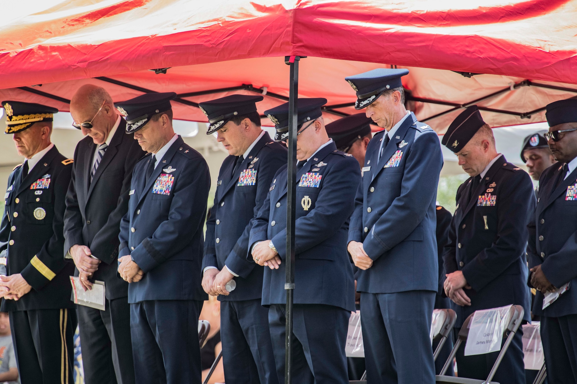 Military leaders and attendees bow their heads during a memorial ceremony May 2, 2019, in Port Wentworth, GA. The event paid homage to the lives of the nine Puerto Rican Air National Guard Airmen who lost their lives when their C-130 Hercules, assigned to the 156th Airlift Wing, crashed May 2, 2018.
