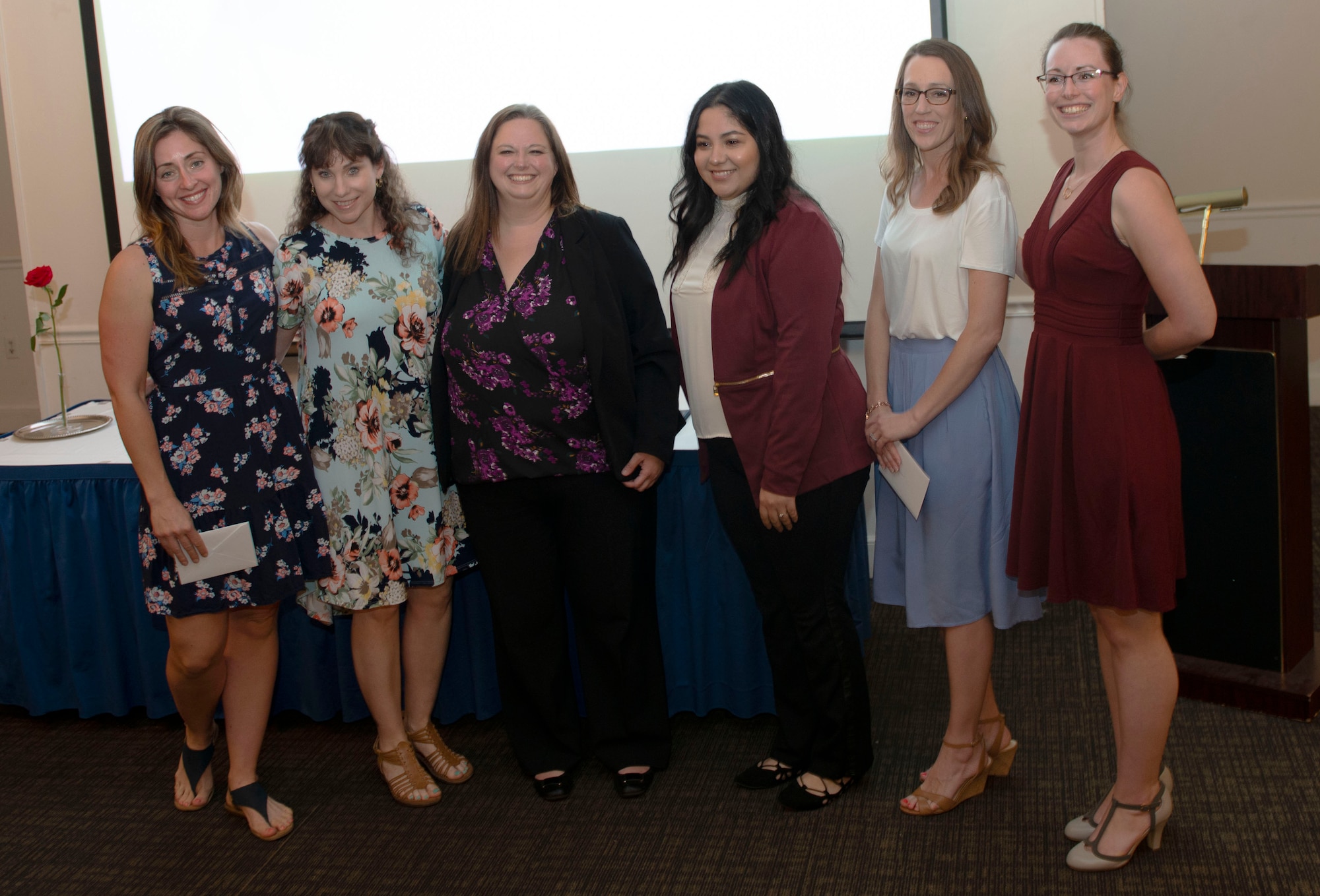 Shaw’s Military Spouse Club stands for a photo at a scholarship giveaway event, at Shaw Air Force Base, S.C., May 1, 2019.