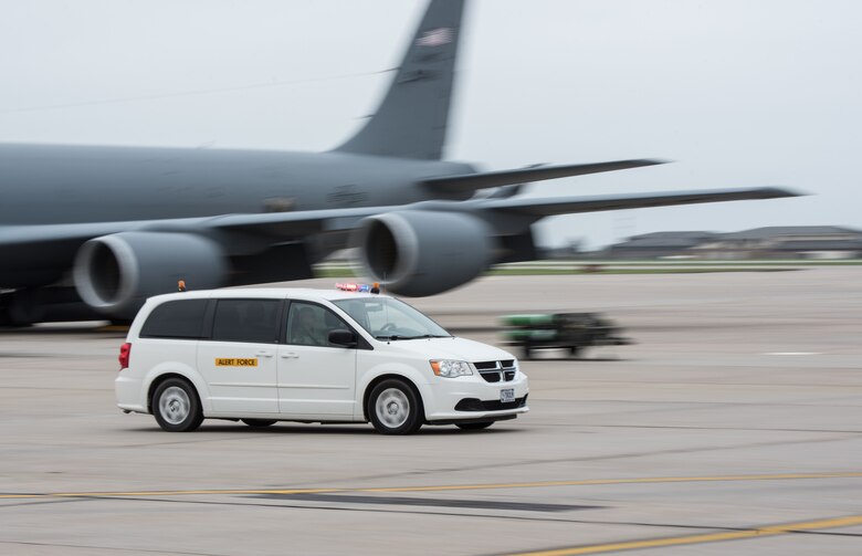 An alerted McConnell aircrew drive towards a KC-135 Stratotanker during an alert demonstration May 1, 2019, at McConnell Air Force Base, Kan. Maj. Gen. Sam Barrett, 18th Air Force commander, reacted with the aircrew during the quick response. (U.S. Air Force photo by Senior Airman Alan Ricker)