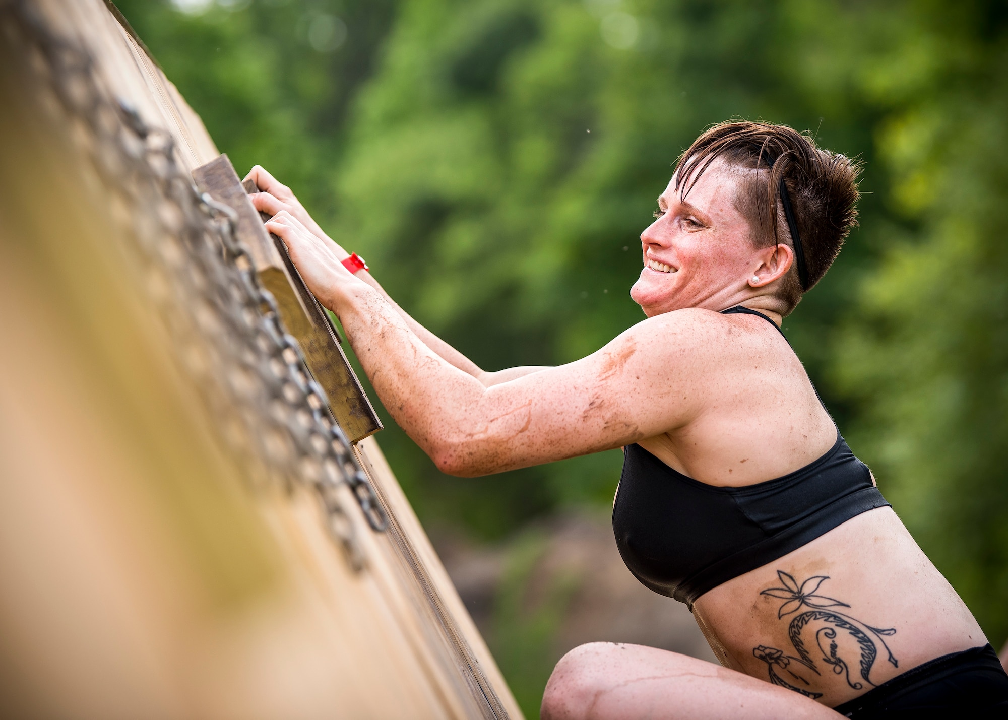 A Moody Mud Run participant attempts an obstacle, May 4, 2019, in Ray City, Ga. The sixth annual Mud Run had approximately 850 participants who had to overcome a series of obstacles on the 4 and 5-mile courses. The 32-obstacle course gave Airmen, families and the local community an opportunity to build camaraderie and teamwork skills. (U.S. Air Force photo by Airman 1st Class Eugene Oliver)