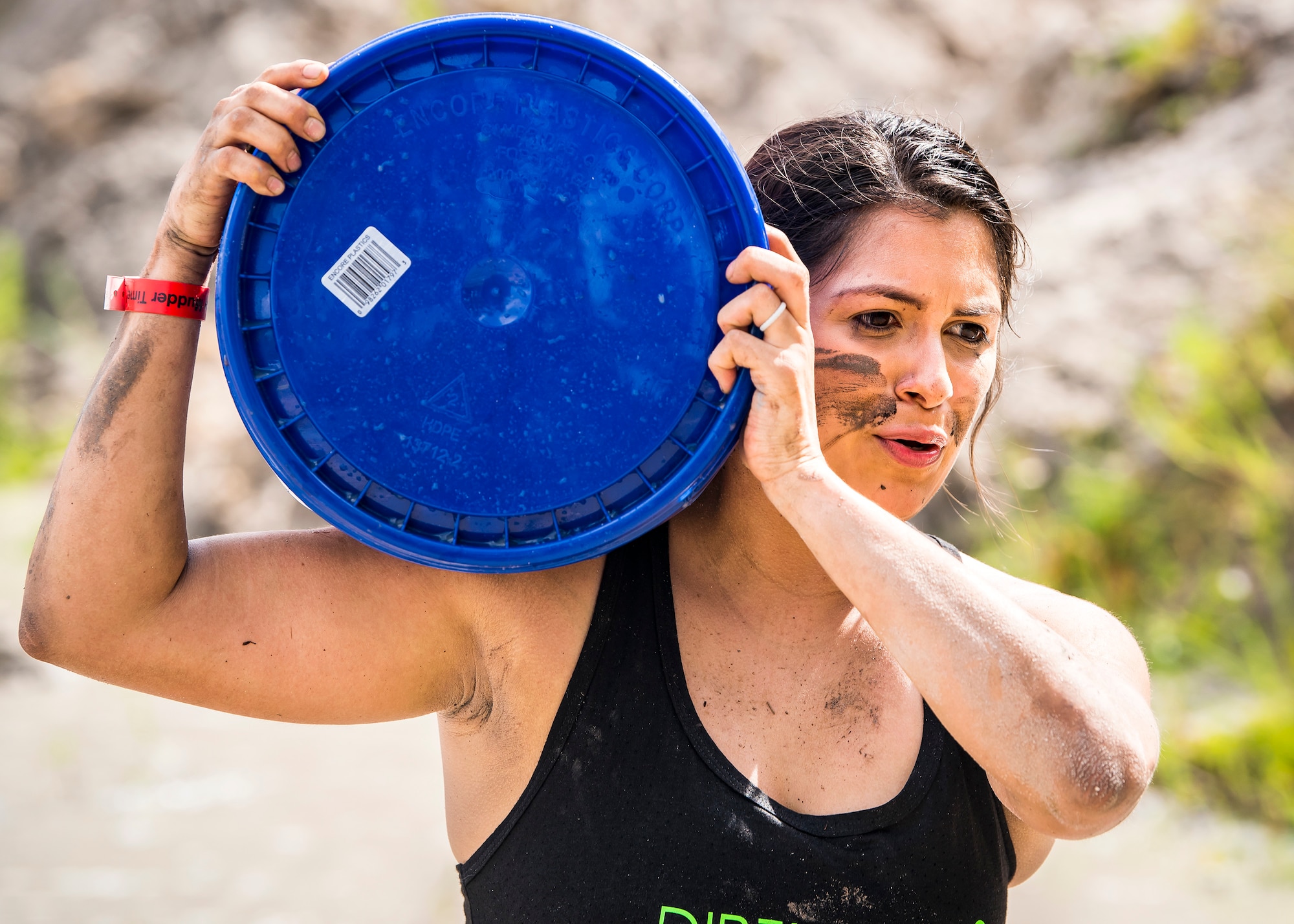 A Moody Mud Run participant carries a jug, May 4, 2019, in Ray City, Ga.The sixth annual Mud Run had approximately 850 participants who had to overcome a series of obstacles on the 4 and 5-mile courses. The 32-obstacle course gave Airmen, families and the local community an opportunity to build camaraderie and teamwork skills. (U.S. Air Force photo by Airman 1st Class Eugene Oliver)