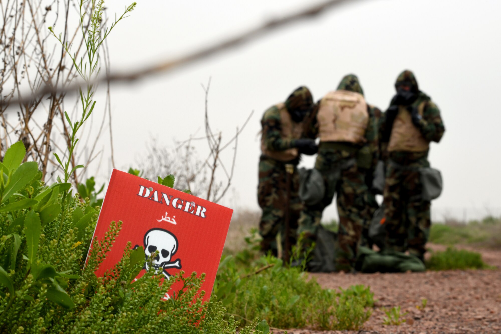 U.S. Air Force Airman conduct a chemical, biological, radiological, nuclear and explosives sweep during the Logistics Readiness Squadron Warrior Challenge May 6, 2019, at Altus Air Force Base, Okla. While participating in the event, teams completed challenges measuring both their physical strength and military knowledge such as finding unexploded ordinance and detecting simulated chemical, biological, radiological, and nuclear contamination. (U.S. Air Force photo by Technical Sergeant Robert Sizelove)