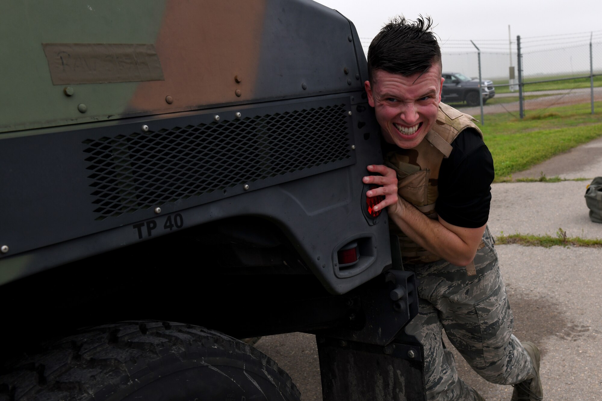 U.S. Air Force Senior Airman Jonathan Yerger, 97th Communication Squadron Radio Frequency Transmission Technician, pushes a High Mobility Multipurpose Wheeled Vehicle during the Logistics Readiness Squadron Warrior Challenge May 6, 2019, at Altus Air Force Base, Okla. While participating in the event, competitors completed challenges measuring both their physical strength and military knowledge. (U.S. Air Force photo by Technical Sergeant Robert Sizelove)