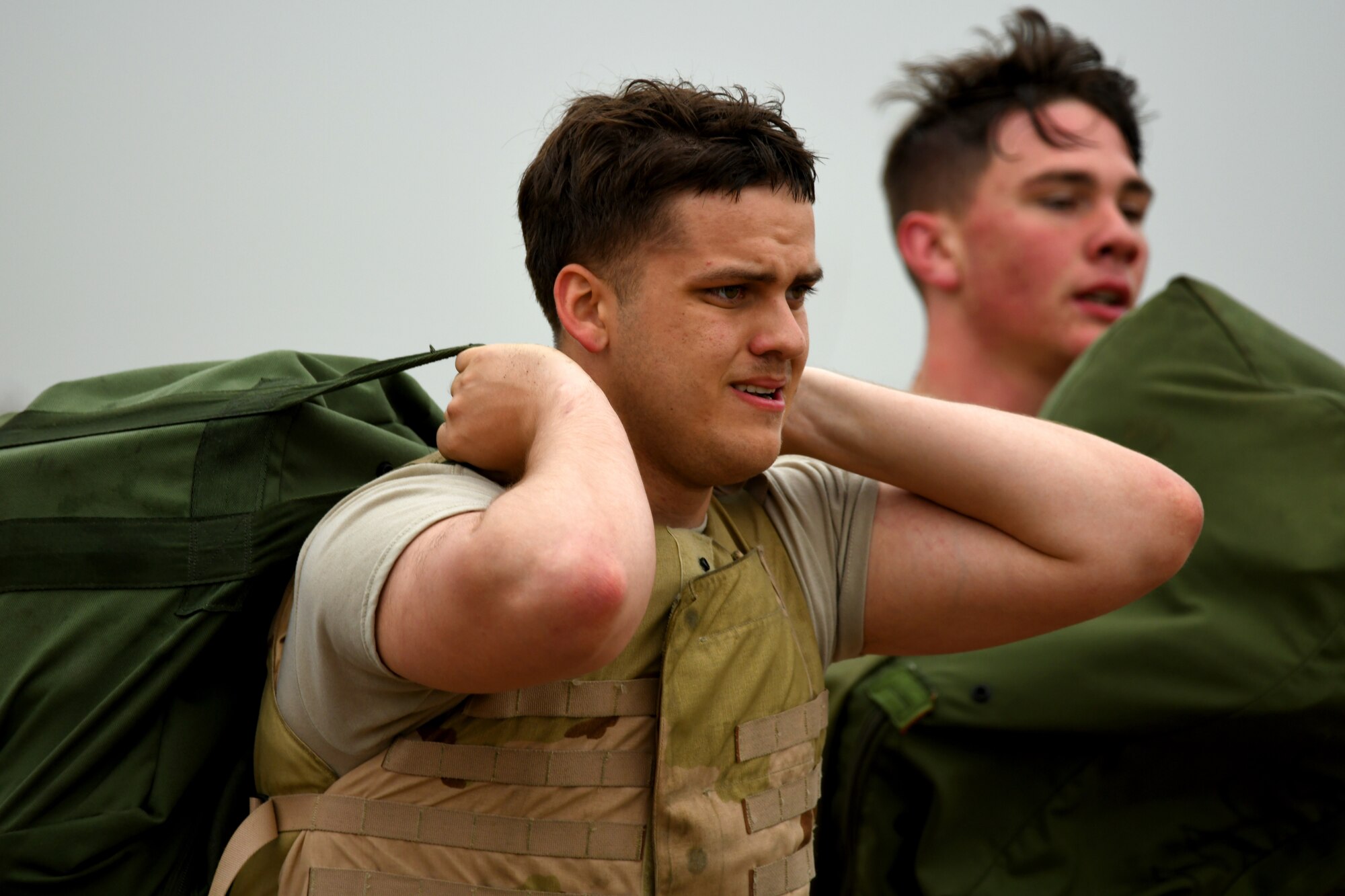U.S. Air Force Airman First Class Trevor Hurt, 97th Logistics Readiness Squadron Aerial Operations Apprentice, carries a mobility bag during the obstacle course portion of the LRS Warrior Challenge May 6, 2019, at Altus Air Force Base, Okla. Challenges in the event measured both their physical strength and military knowledge. (U.S. Air Force photo by Technical Sergeant Robert Sizelove)
