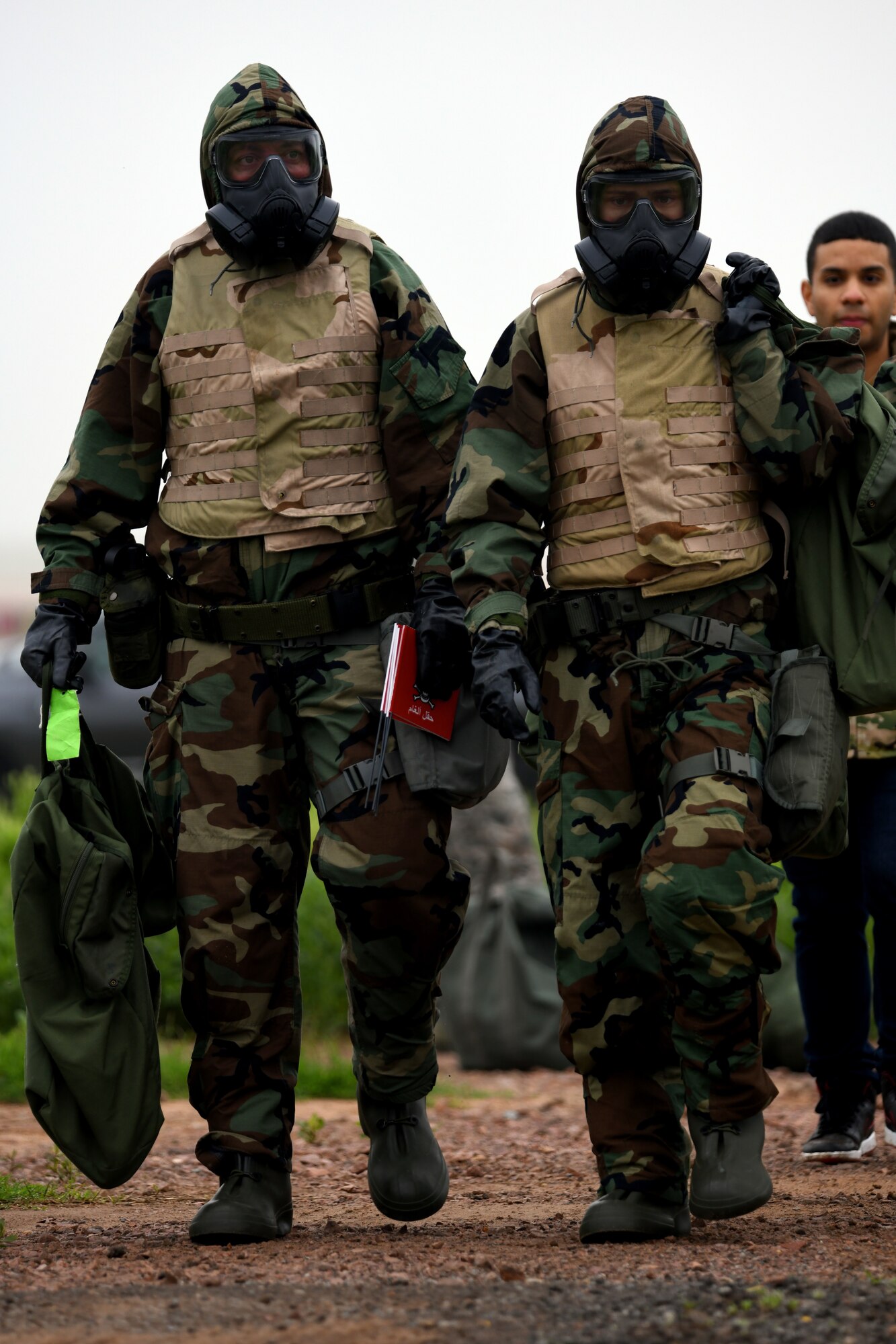 U.S. Air Force Technical Sergeant Brian Toth (left) and Technical Sergeant Nicholas Samuelson, 97th Logistics Readiness Squadron Fuels Management Flight, conduct a chemical, biological, radiological, nuclear and explosives sweep during the LRS Warrior Challenge May 6, 2019, at Altus Air Force Base, Okla. While participating in the event, they completed challenges measuring both their physical strength and military knowledge, such as finding unexploded ordinance and detecting simulated chemical, biological, radiological, and nuclear contamination. (U.S. Air Force photo by Technical Sergeant Robert Sizelove)