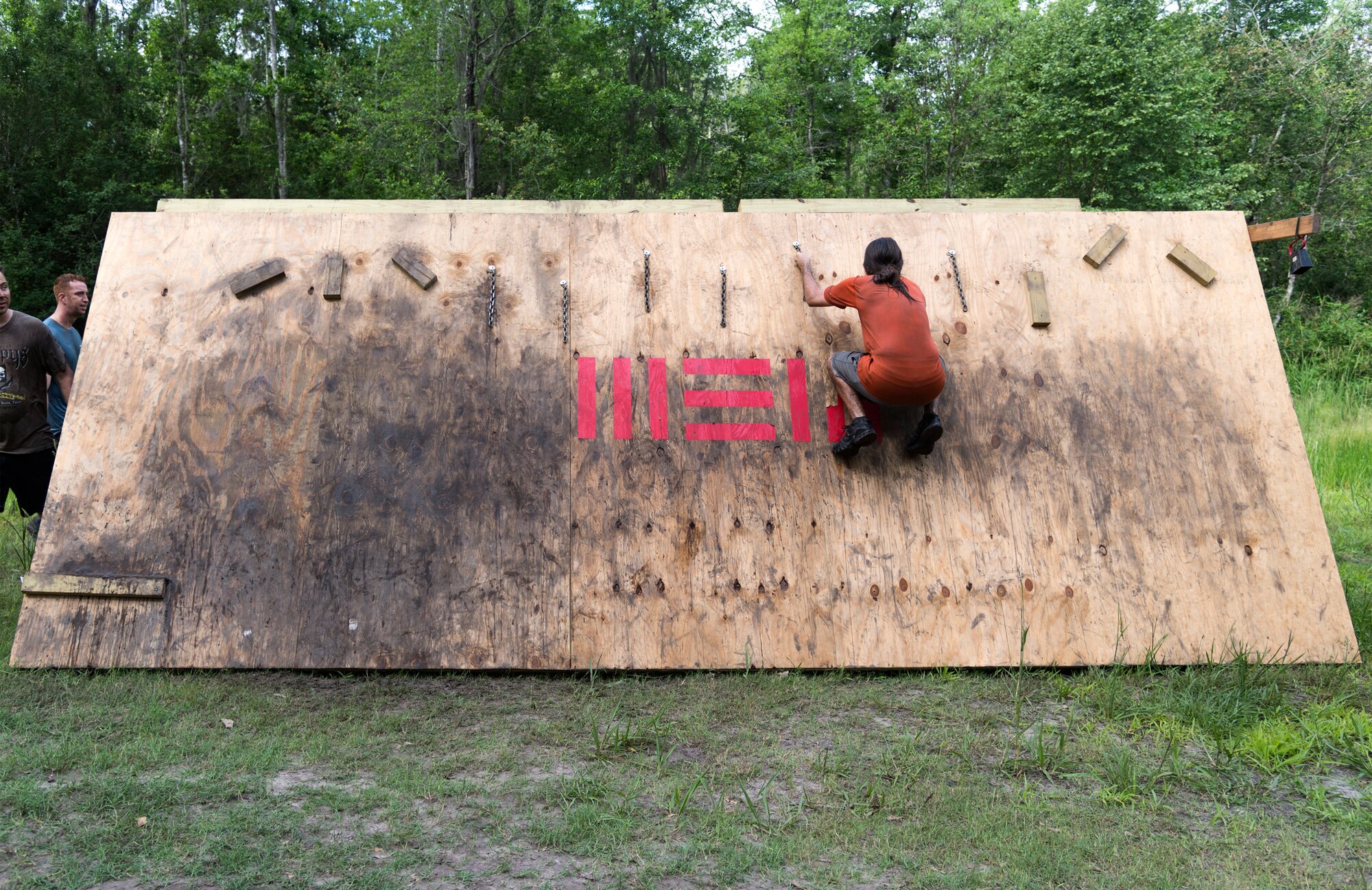 A participant crosses an obstacle during the Moody Mud Run, May 4, 2019, at Possum Creek Off-Road Park in Ray City, Ga. The sixth annual Moody Mud Run had approximately 850 participants who had to overcome a series of obstacles on the 4 and 5-mile courses. The 32-obstacle course gave Airmen, families and the local community an opportunity to build camaraderie and teamwork skills. (U.S. Air Force Photo by Airman 1st Class Taryn Butler)