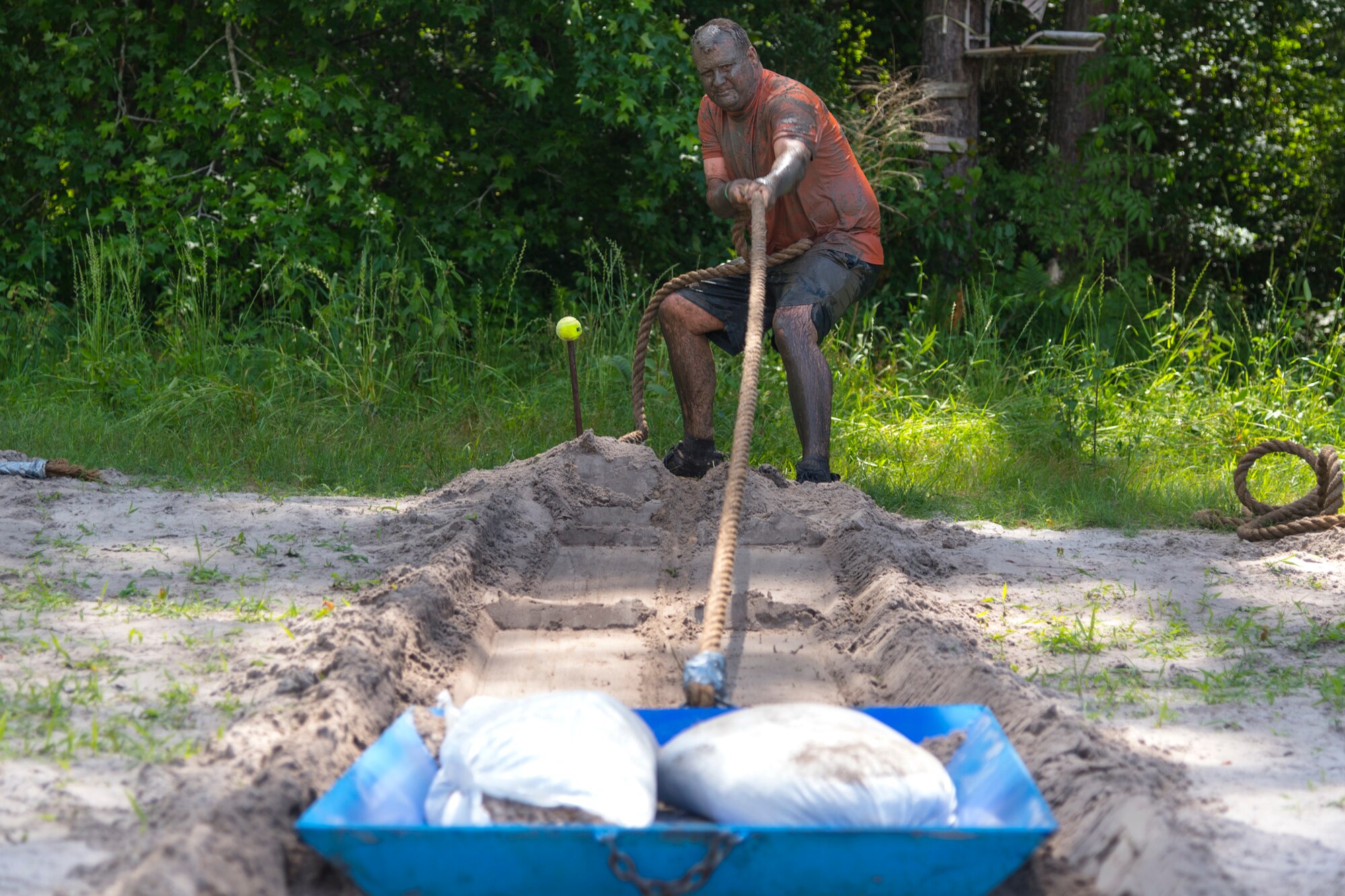 A participant pulls a weighted sled during the Moody Mud Run, May 4, 2019, at Possum Creek Off-Road Park in Ray City, Ga. The sixth annual Moody Mud Run had approximately 850 participants who had to overcome a series of obstacles on the 4 and 5-mile courses. The 32-obstacle course gave Airmen, families and the local community an opportunity to build camaraderie and teamwork skills. (U.S. Air Force Photo by Airman 1st Class Taryn Butler)