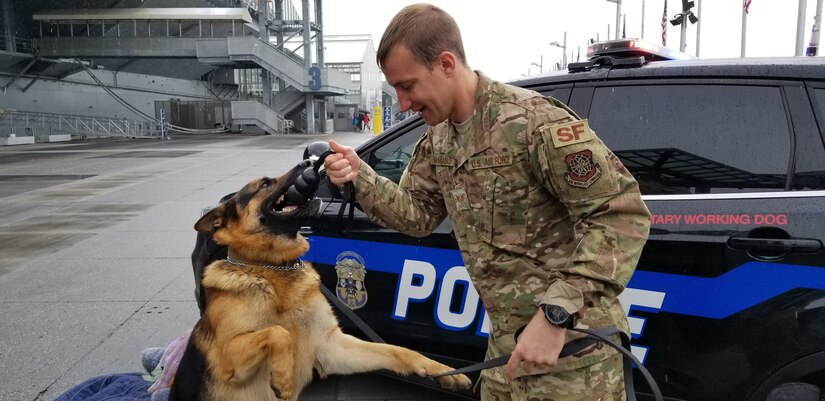 U.S. Air Force Staff Sgt. Jonathan McManus, 87th Security Forces Squadron military working dog handler , interacts with military working dog “Timo” at the Air Force Convention in New York City, May 4, 2019.